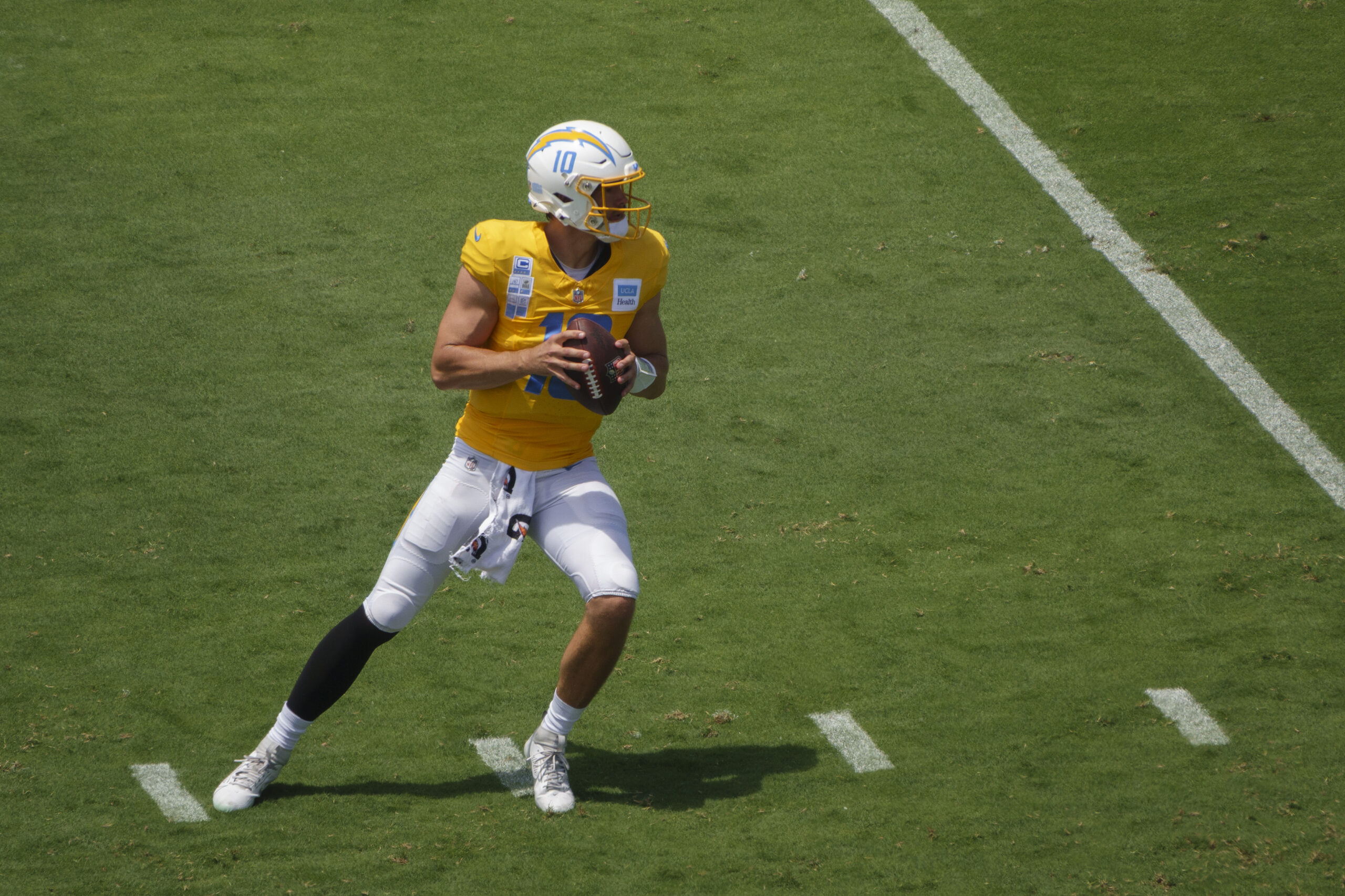 Chargers quarterback Justin Herbert drops back to pass during a...