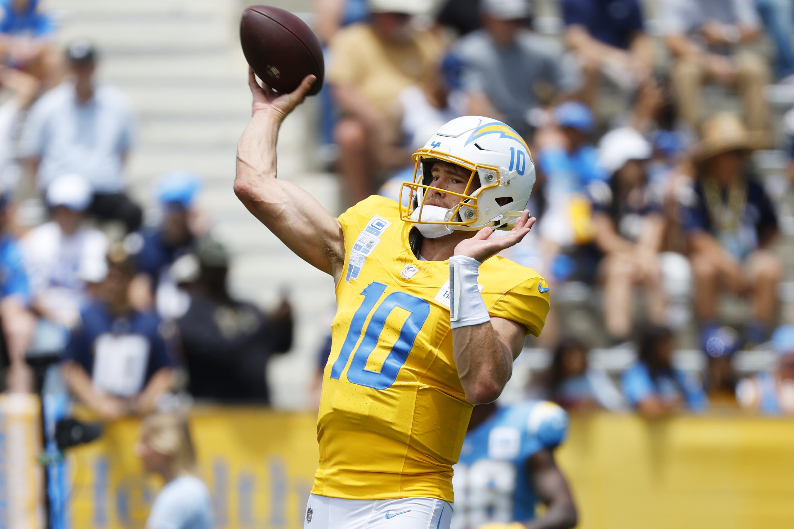 Chargers quarterback Justin Herbert throws a pass during a practice...