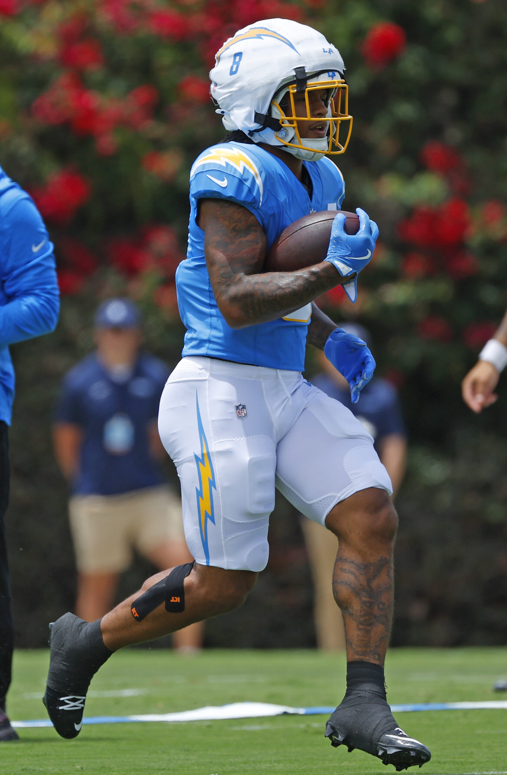 Chargers rookie running back Omarion Hampton carries the ball during...