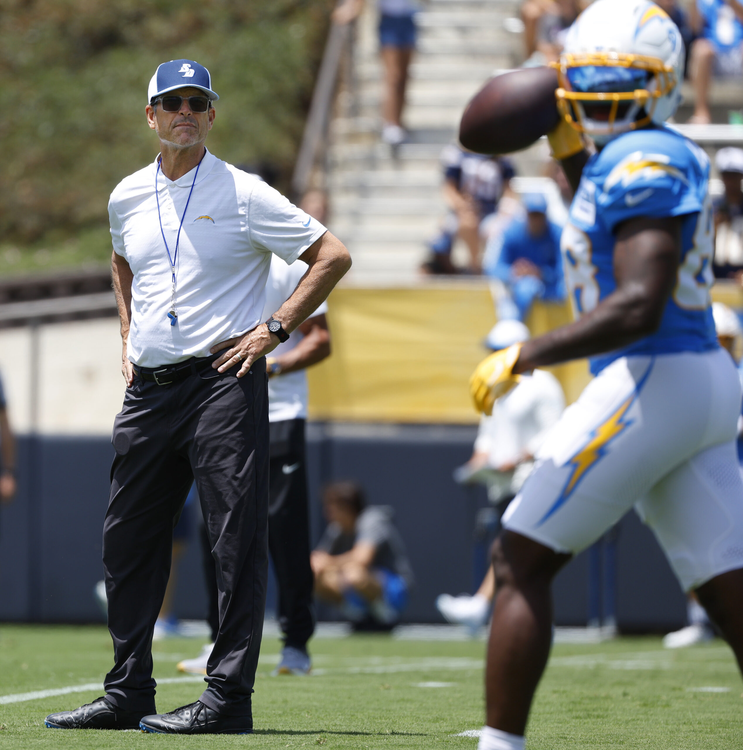 Chargers head coach Jim Harbaugh looks on during a practice...