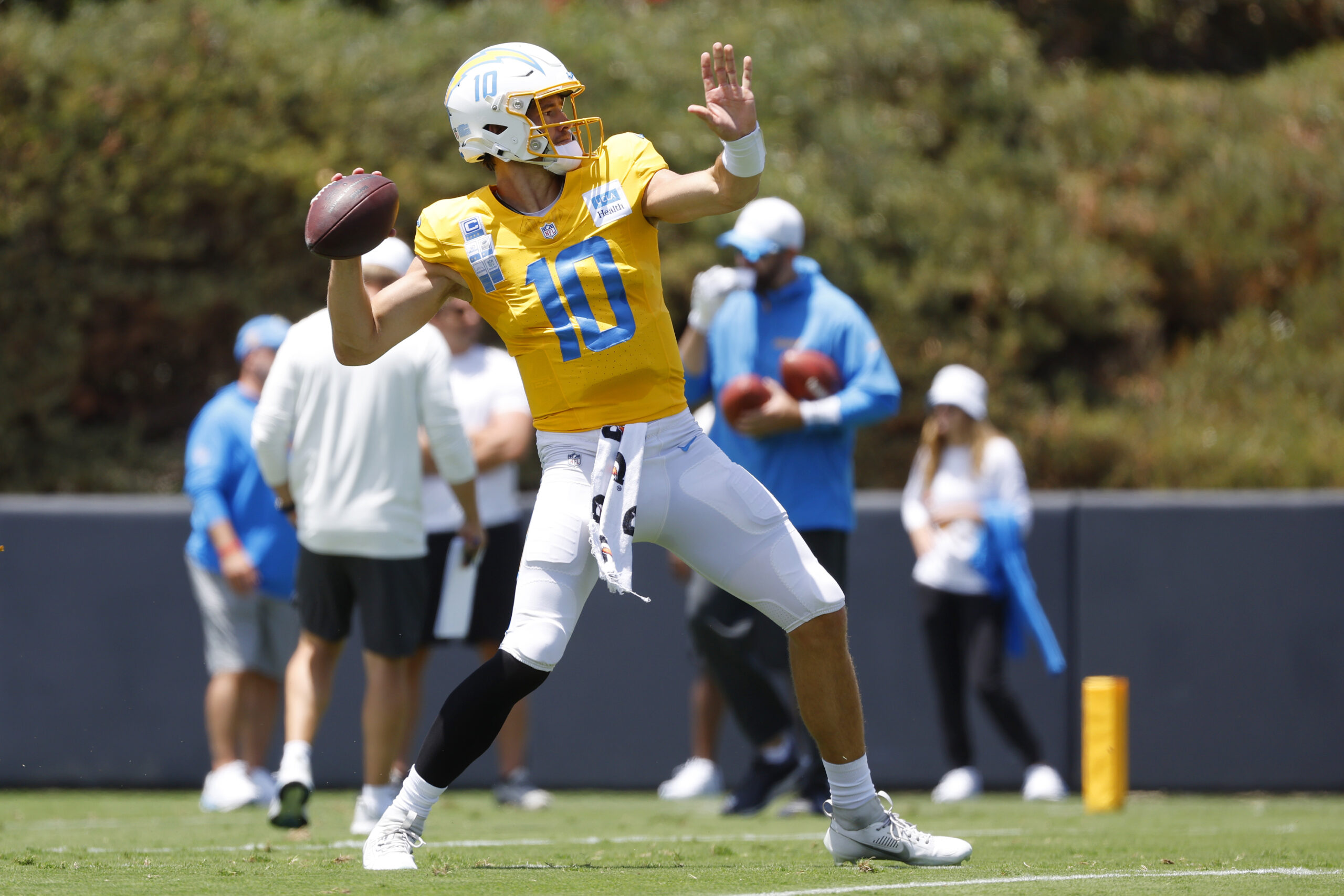 Chargers quarterback Justin Herbert throws a pass during a practice...
