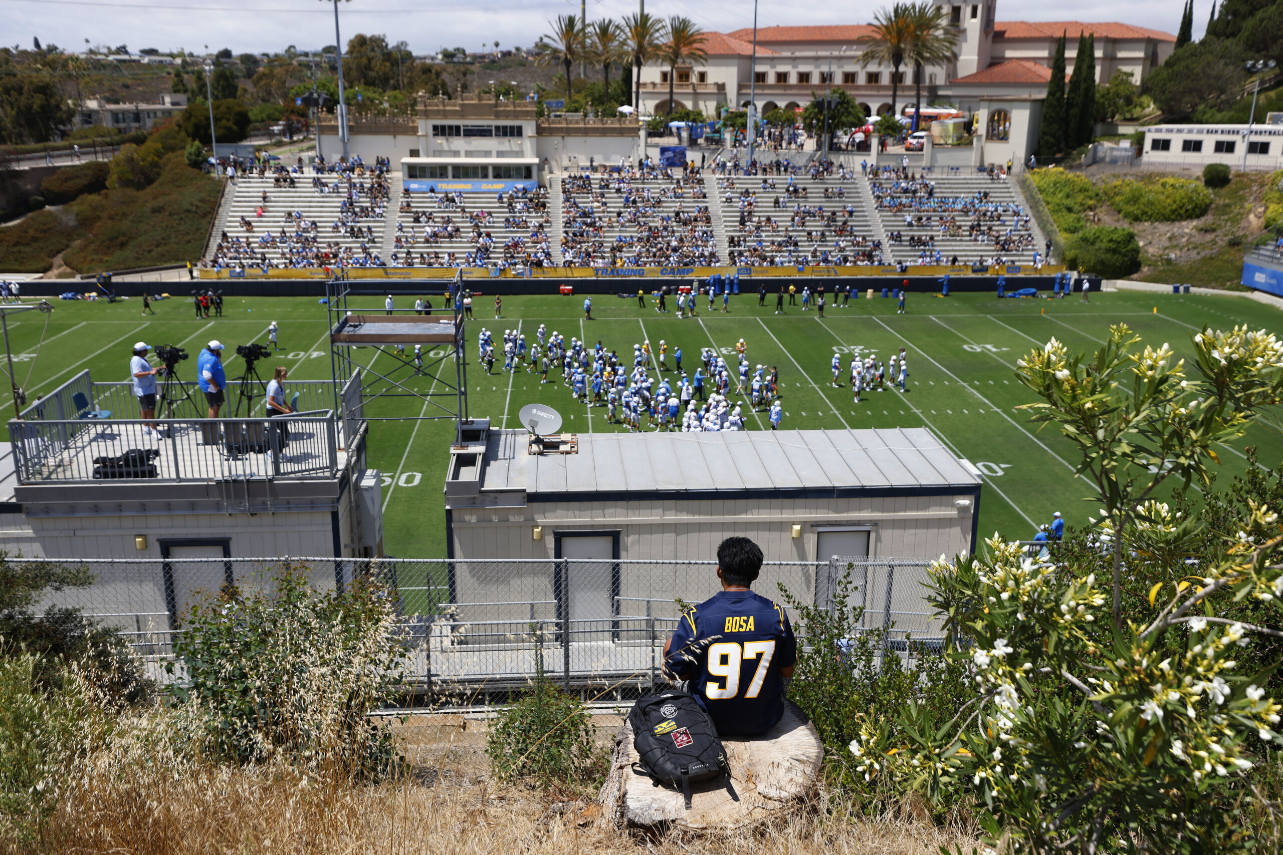A fan looks on as the Los Angeles Chargers hold...