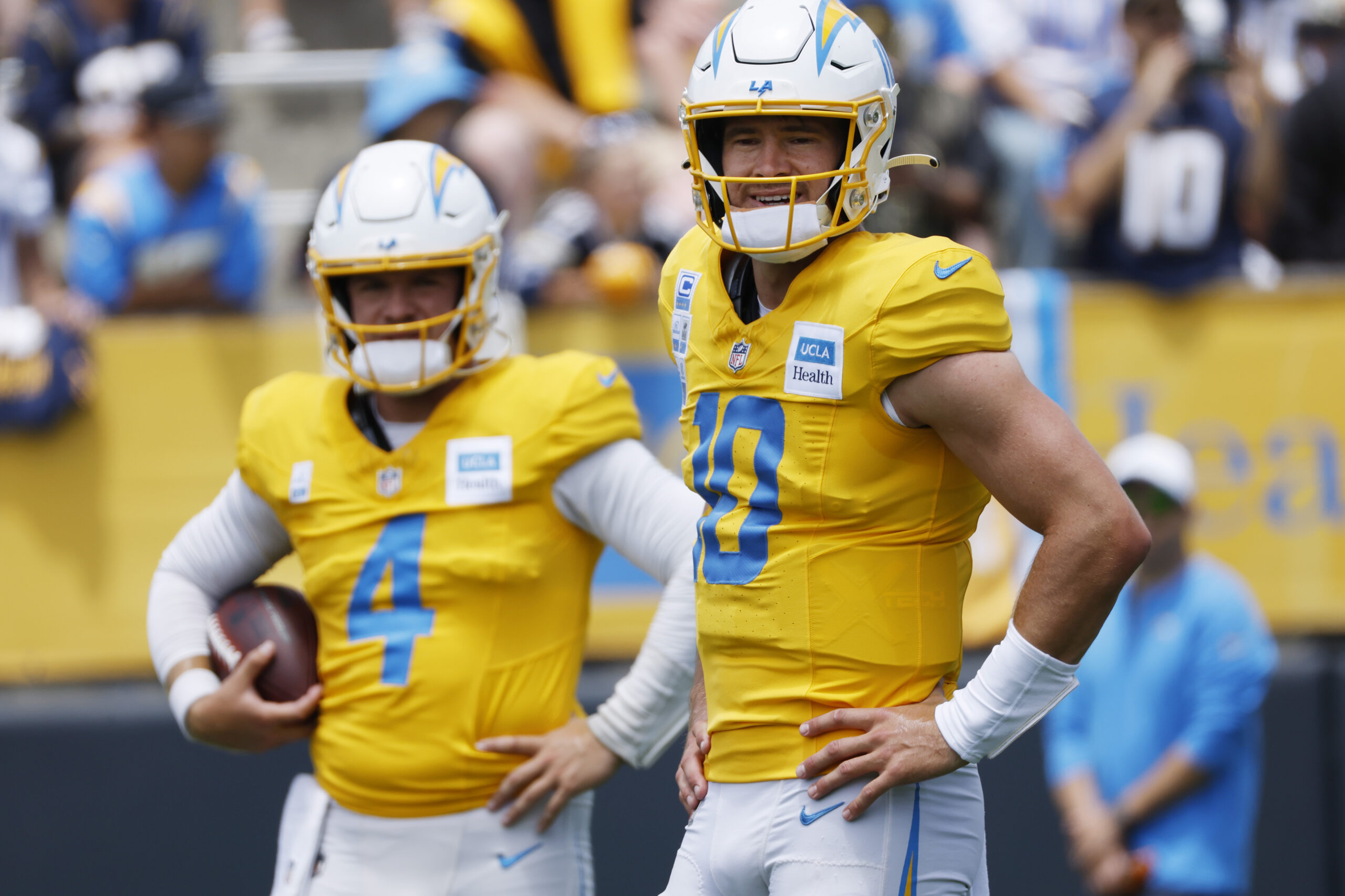 Chargers quarterback Justin Herbert, right, and veteran backup QB Taylor...