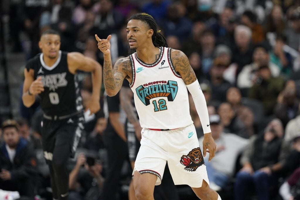 Memphis Grizzlies guard Ja Morant (12) reacts after scoring a three point basket during the second half at Frost Bank Center.