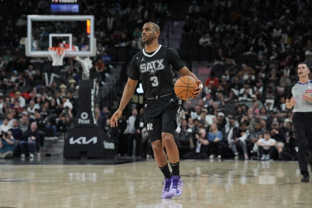 Jan 29, 2025; San Antonio, Texas, USA; San Antonio Spurs guard Chris Paul (3) dribbles up the court in the second half against the LA Clippers at Frost Bank Center. Mandatory Credit: Daniel Dunn-Imagn Images