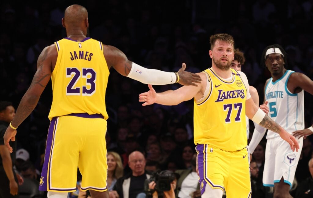 Los Angeles Lakers forward LeBron James (23) and guard Luka Doncic
