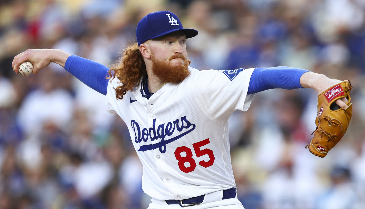 Dodgers starting pitcher Dustin May throws to the plate during...