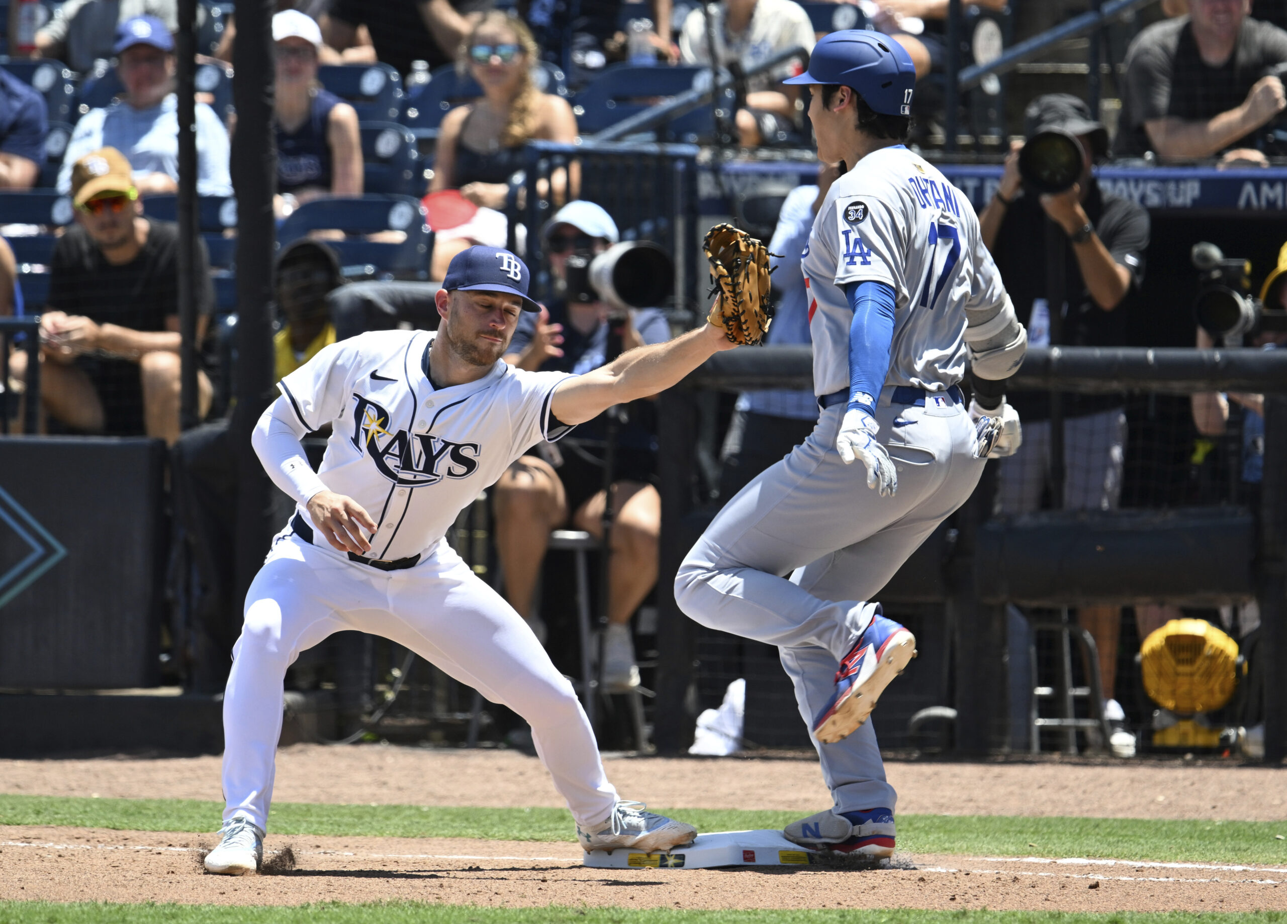 Dodgers’ Shohei Ohtani beats the throw to Tampa Bay Rays...