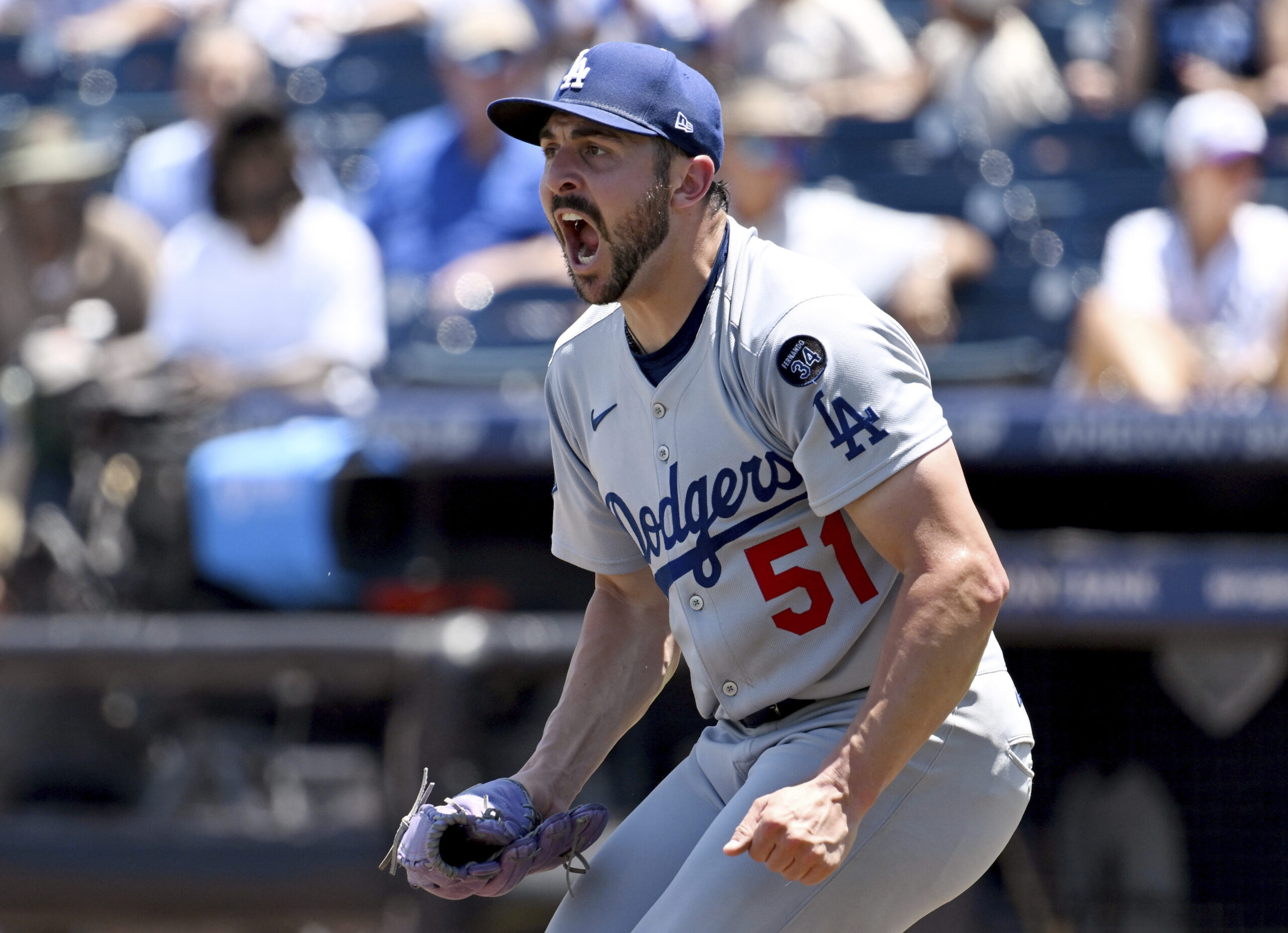 Dodgers pitcher Alex Vesia celebrates after the final out of...