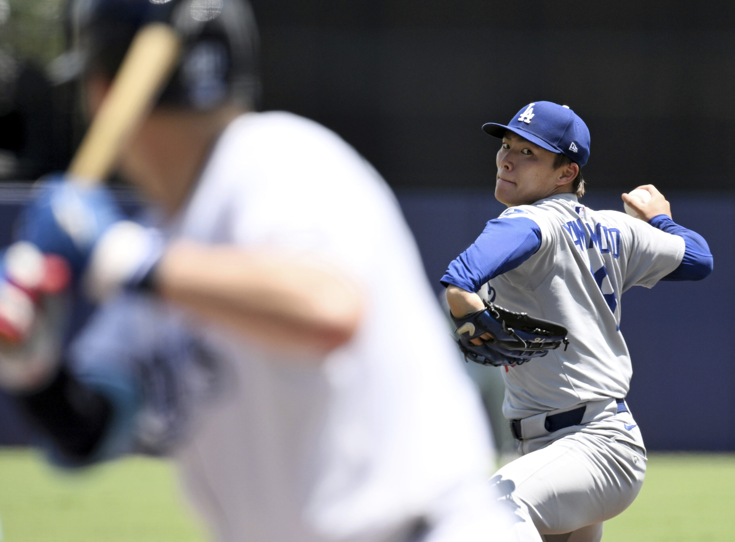 Dodgers pitcher Yoshinobu Yamamoto throws during the fourth inning of...