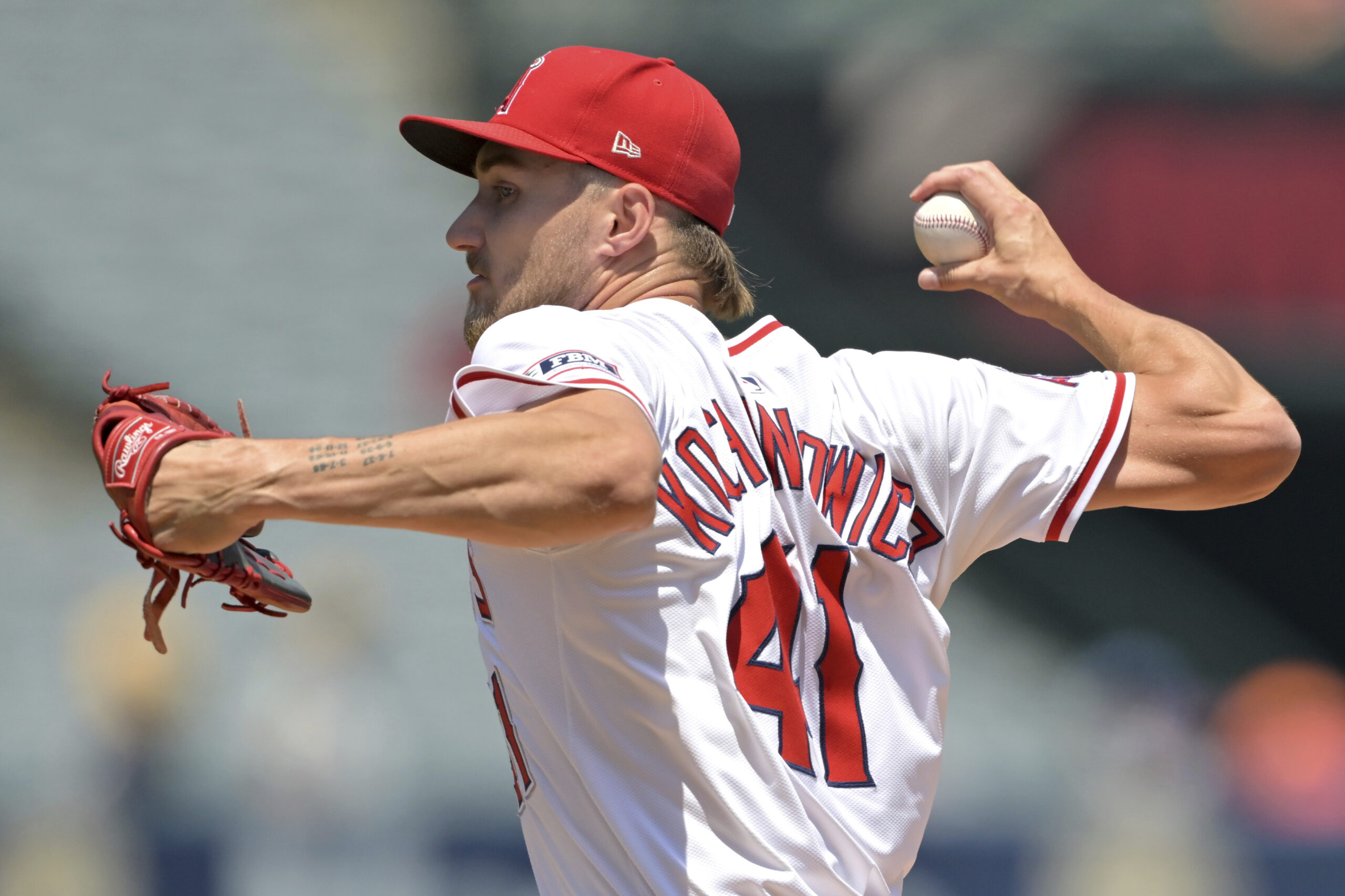 Angels starting pitcher Jack Kochanowicz delivers to the plate during...