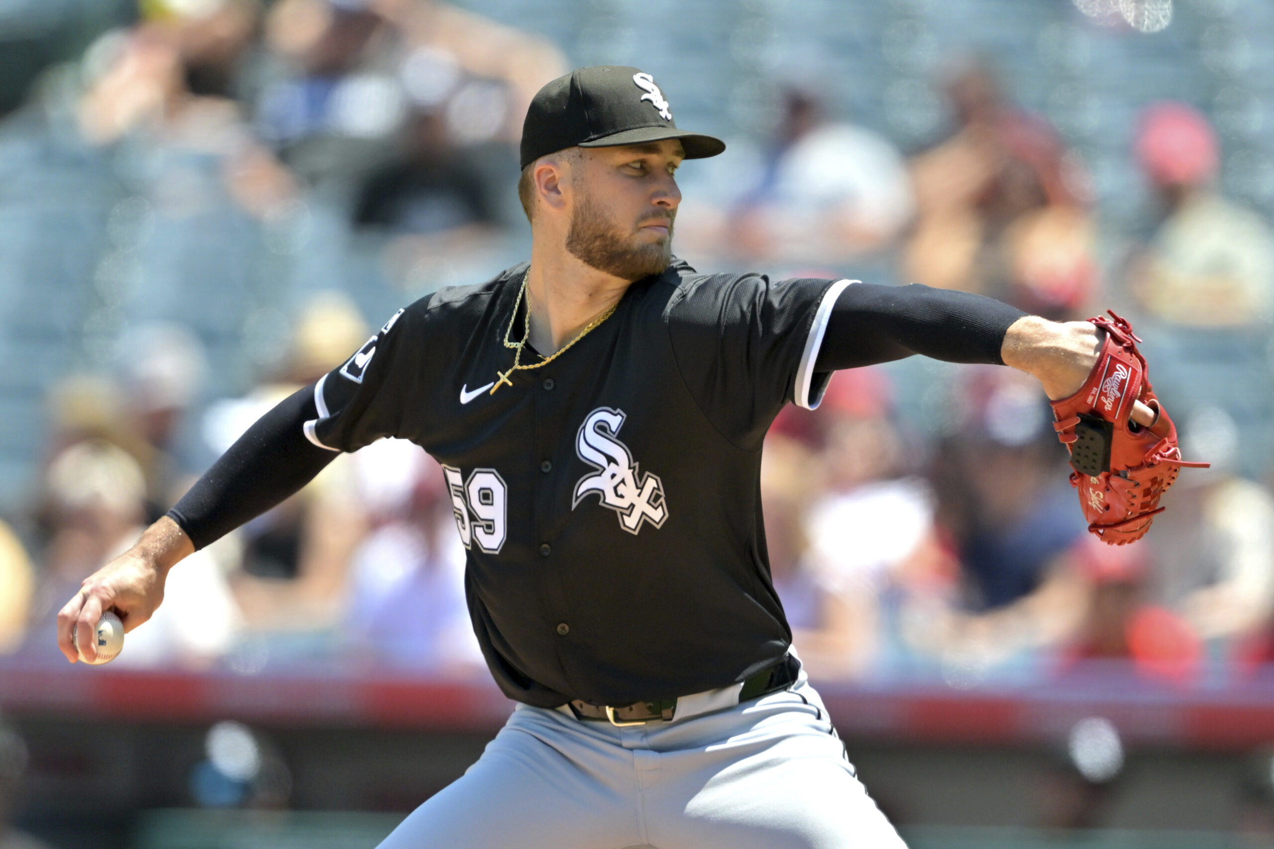 Chicago White Sox starting pitcher Sean Burke delivers to the...
