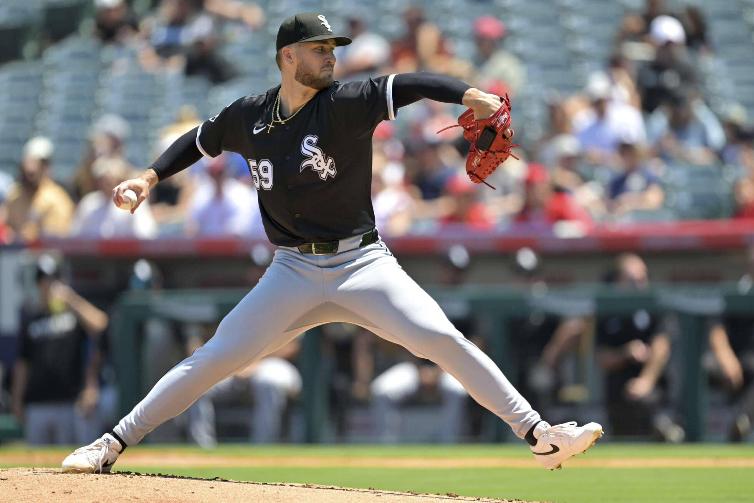 Chicago White Sox starting pitcher Sean Burke delivers to the...