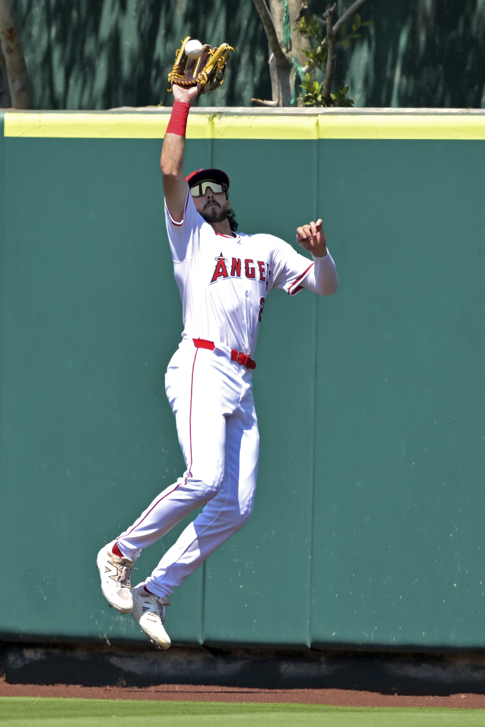 Angeles center fielder Bryce Teodosio makes a leaping catch off...