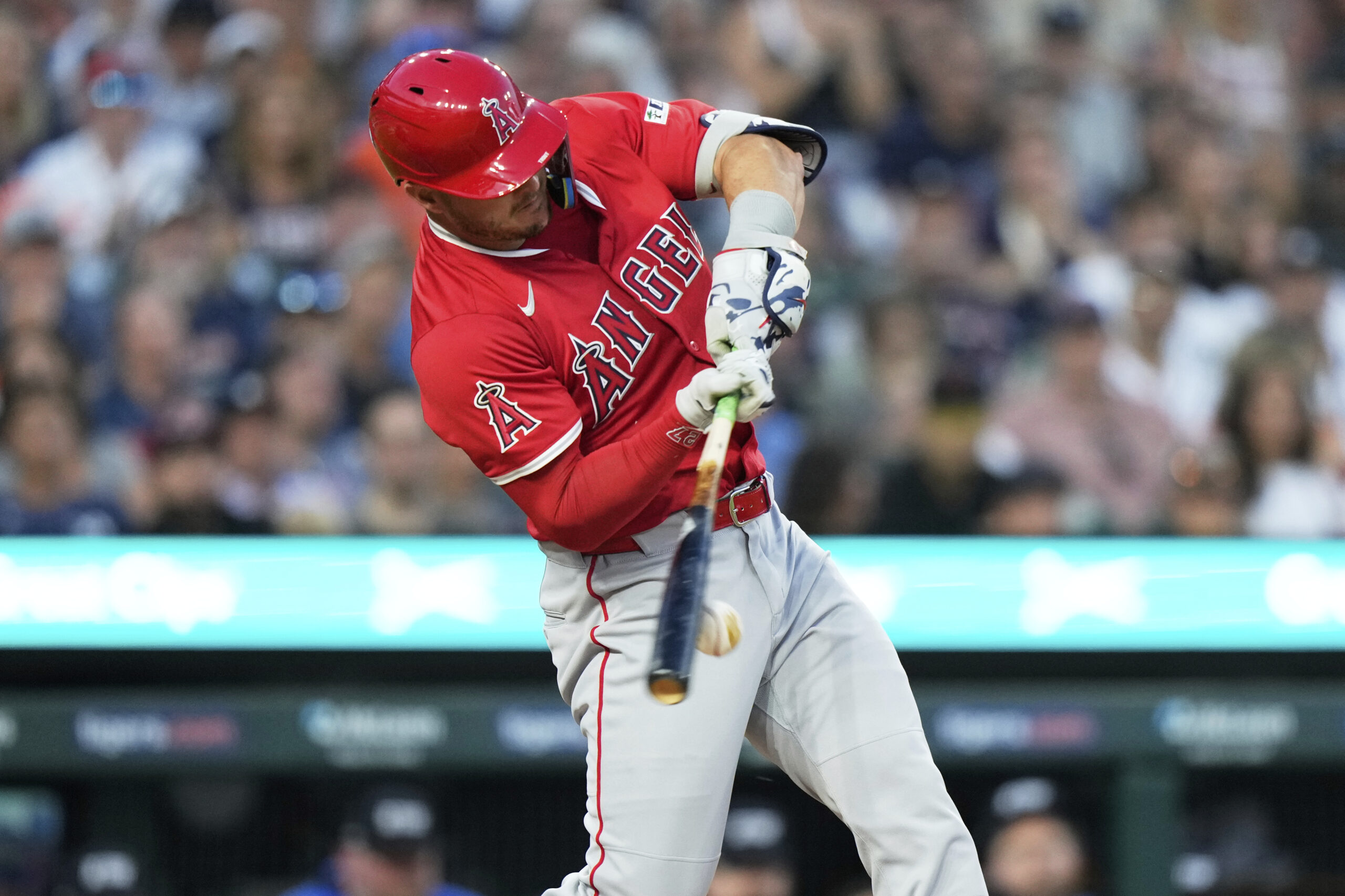 Angels designated hitter Mike Trout hits a single during the...