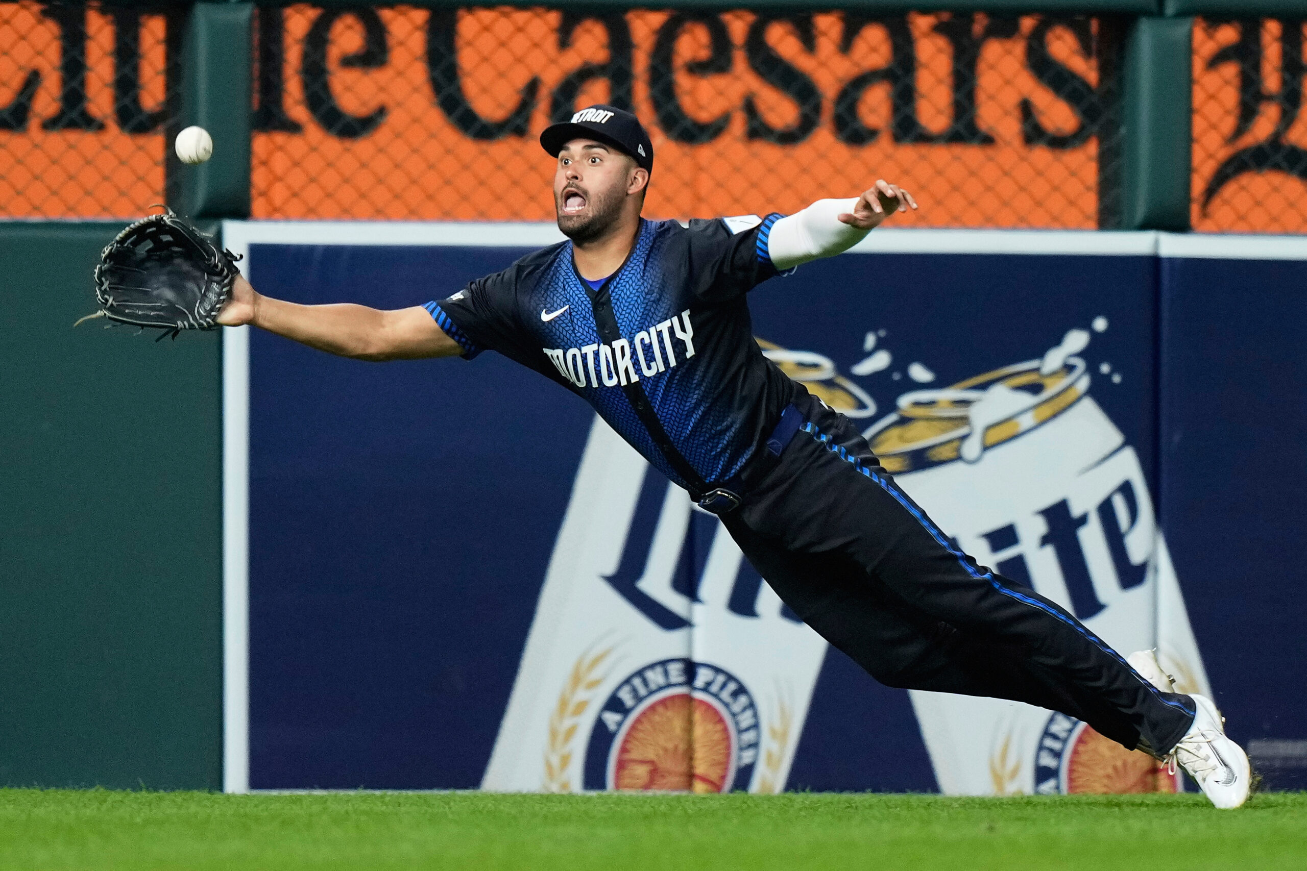 Detroit Tigers left fielder Riley Greene makes a leaping catch...