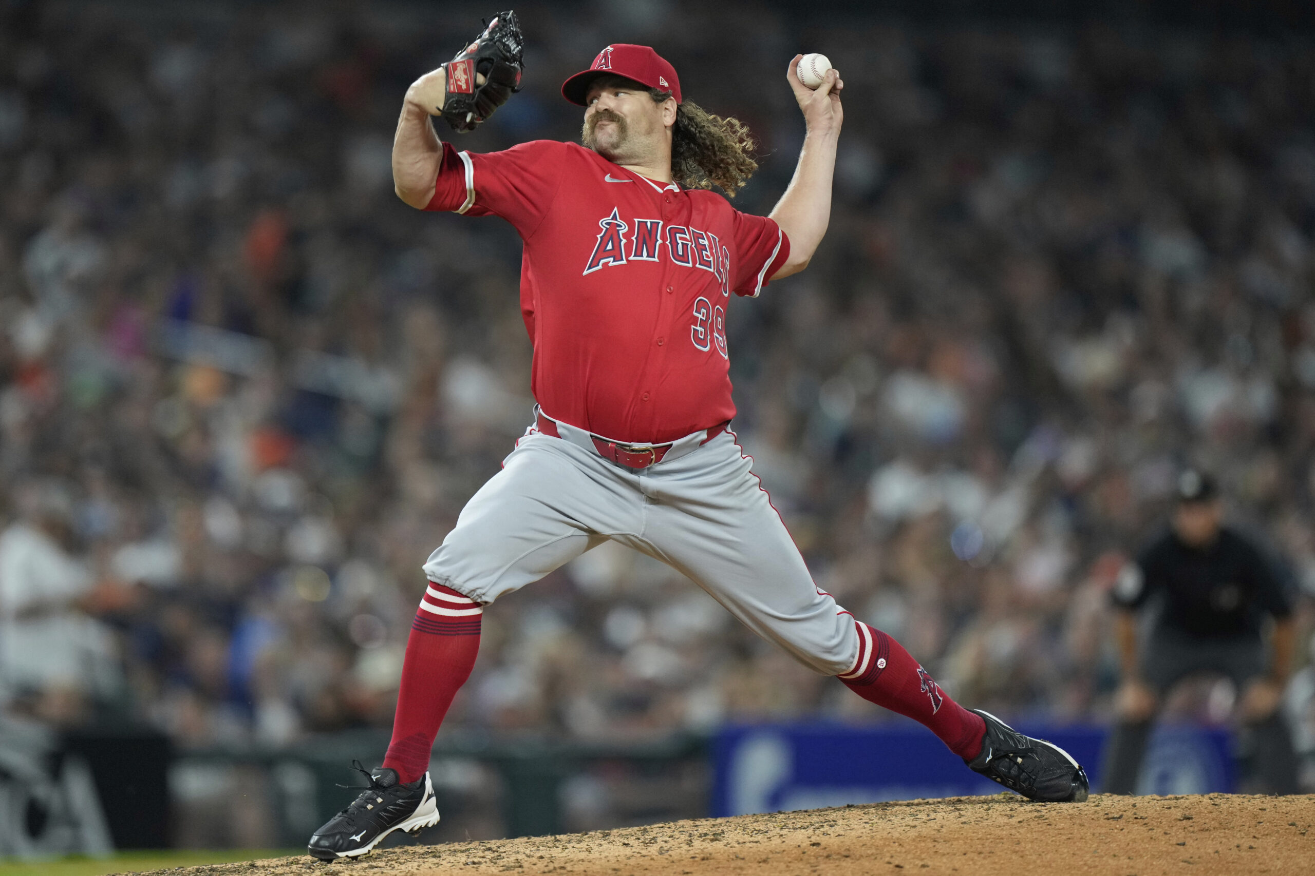 Angels relief pitcher Andrew Chafin throws during the eighth inning...
