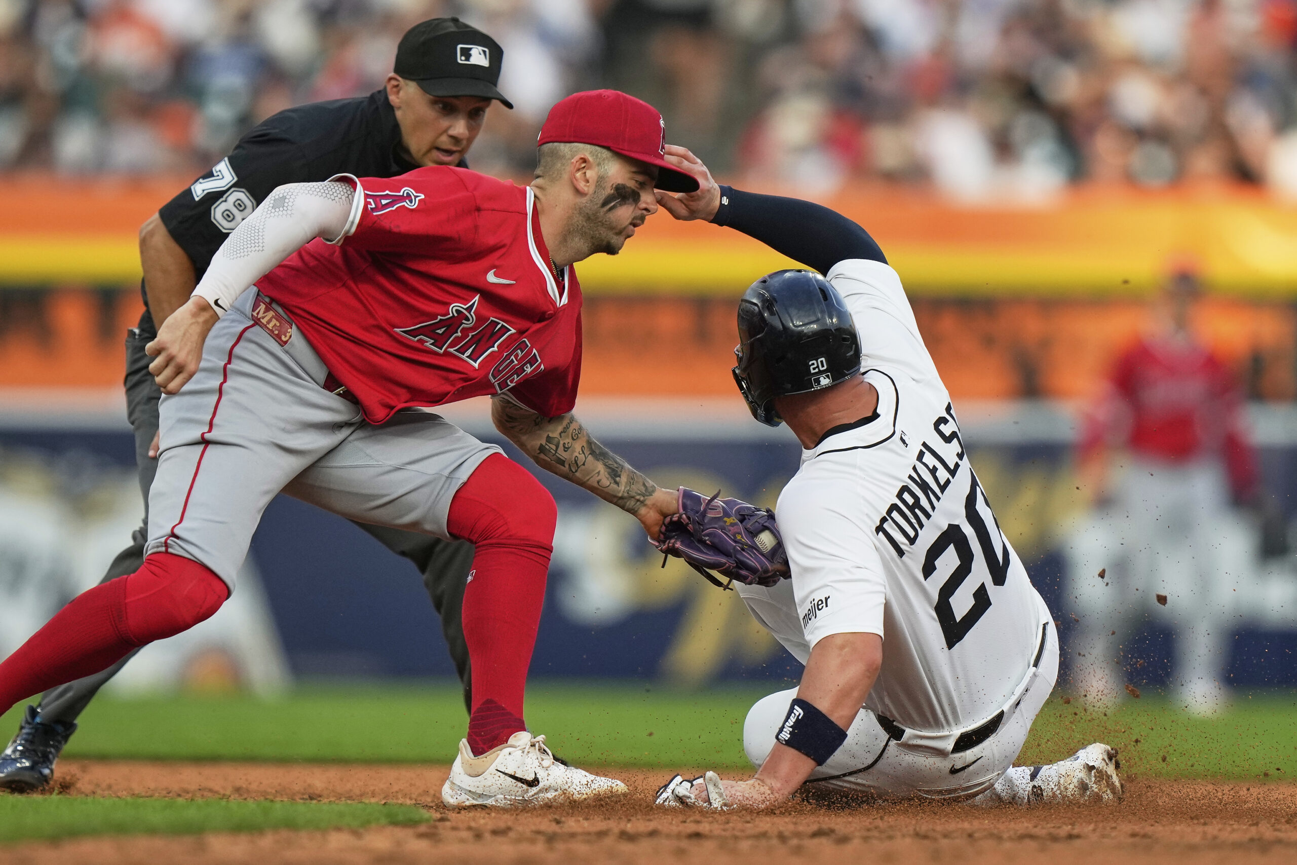Detroit Tigers’ Spencer Torkelson, right, is tagged out at second...