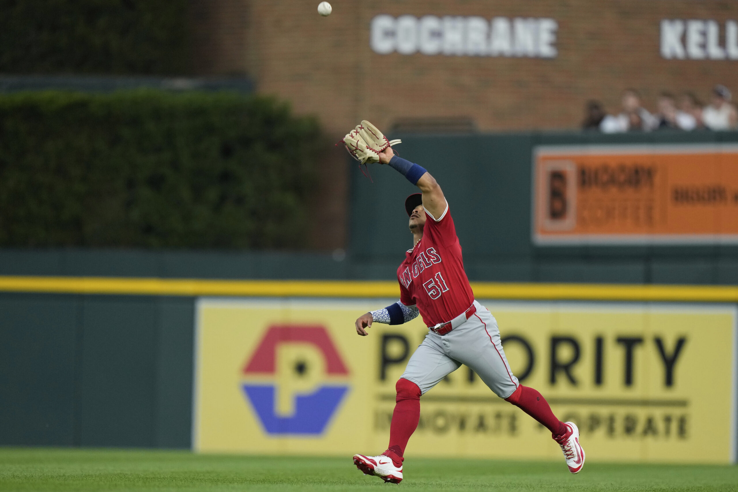 Angels right fielder Gustavo Campero catches a flyout hit by...