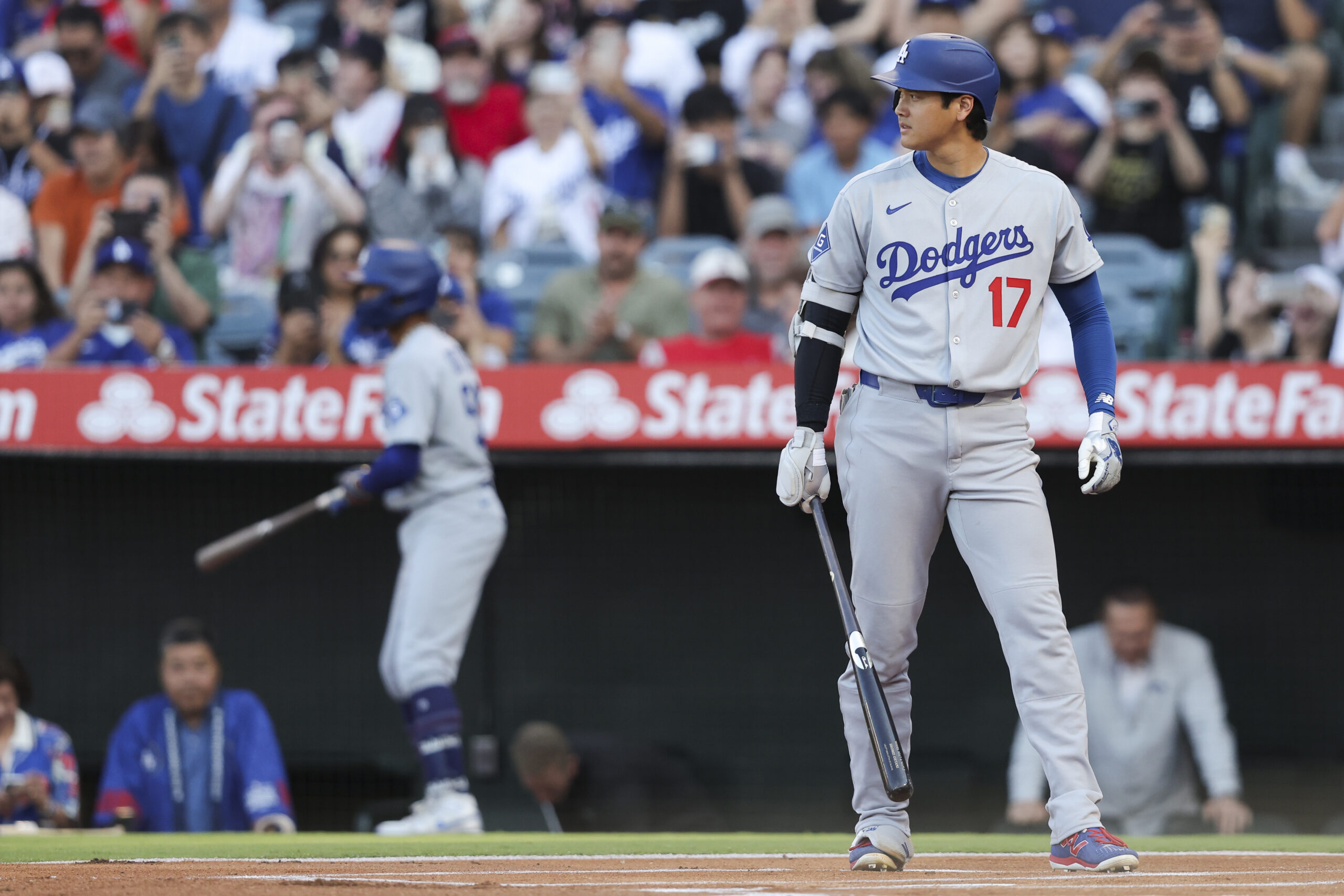 Dodgers star Shohei Ohtani prepares to bat during the first...