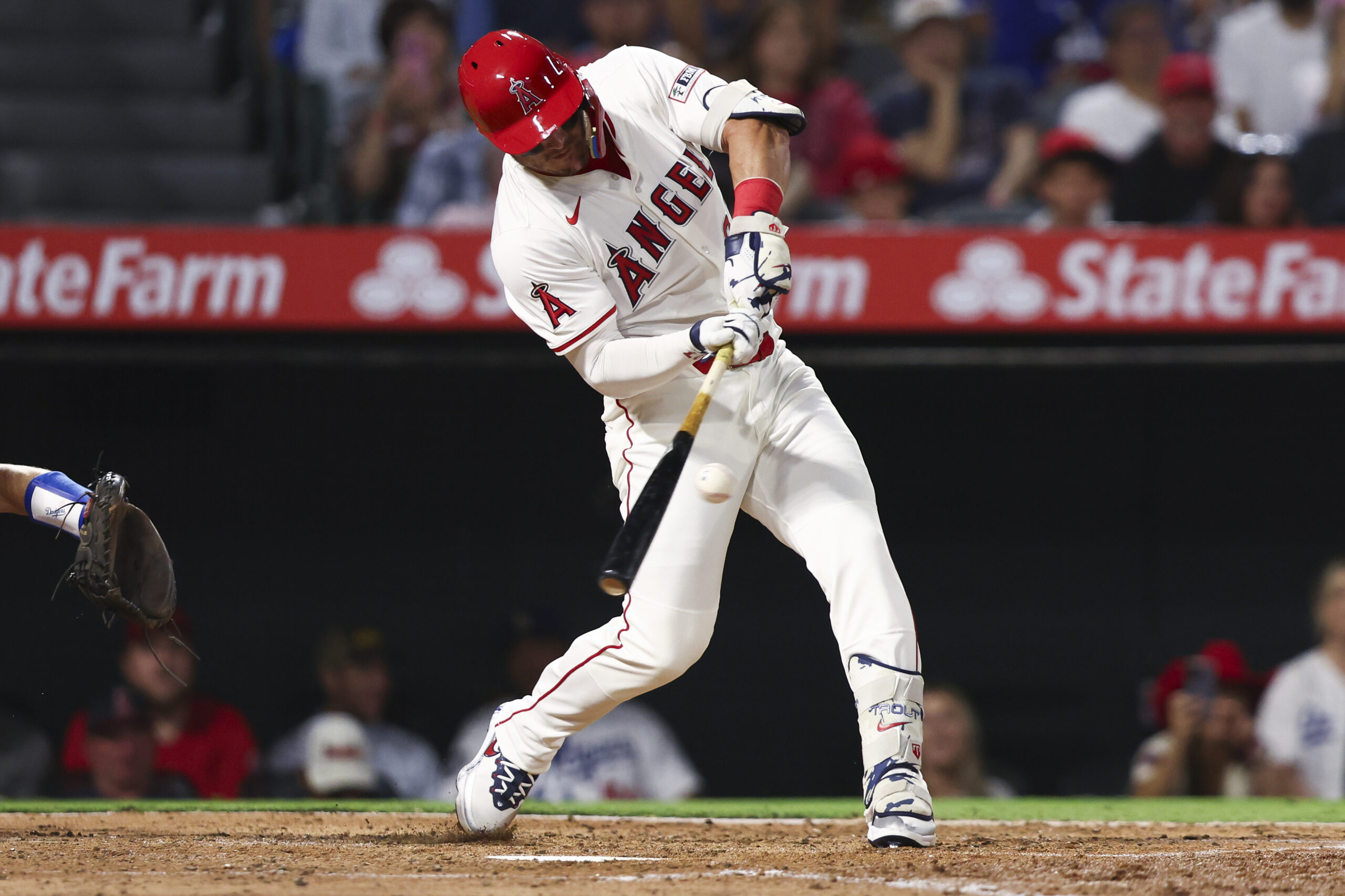 Angels designated hitter Mike Trout hits a two-run single during...