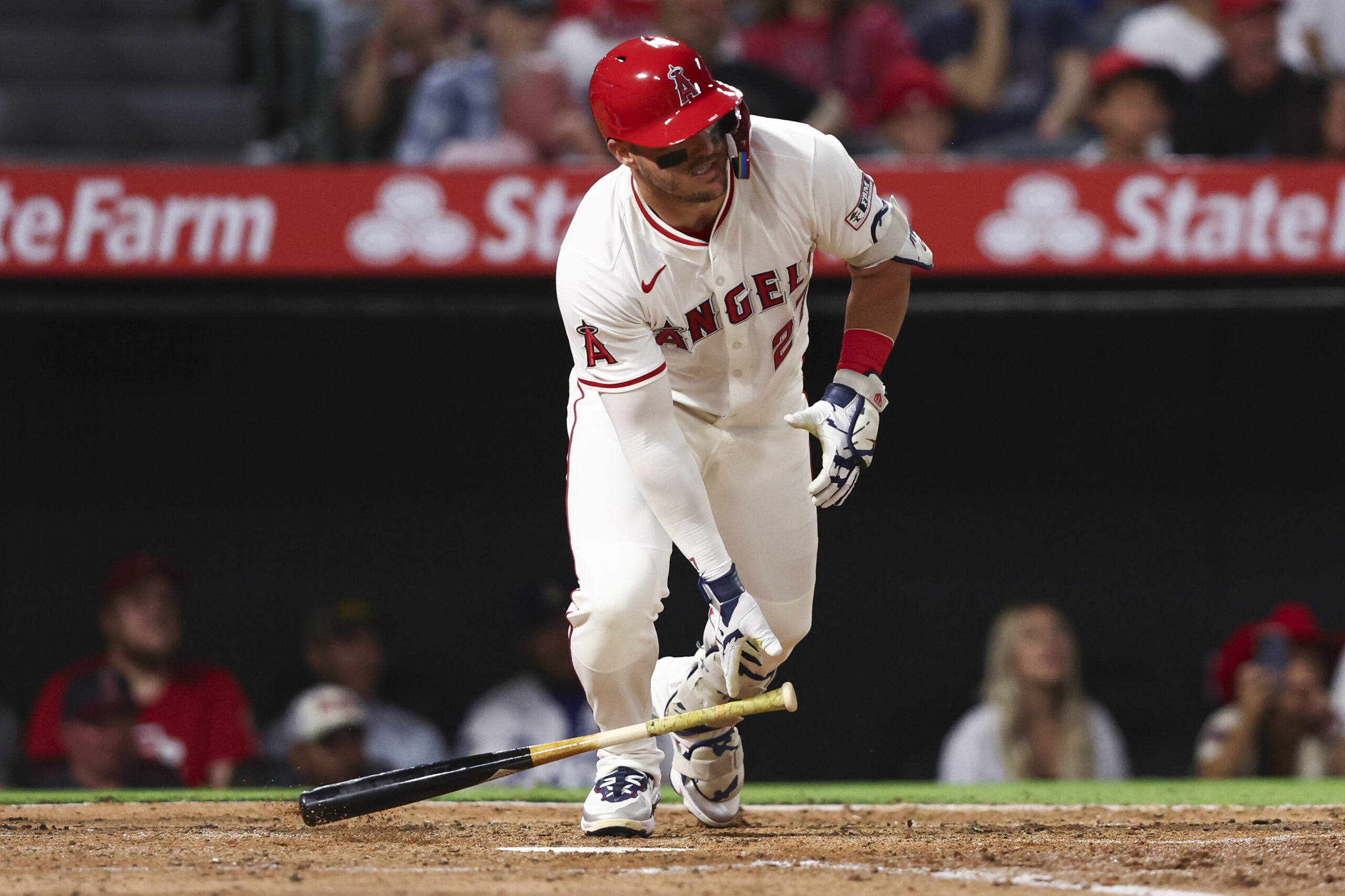 Angels designated hitter Mike Trout drops his bat after hitting...