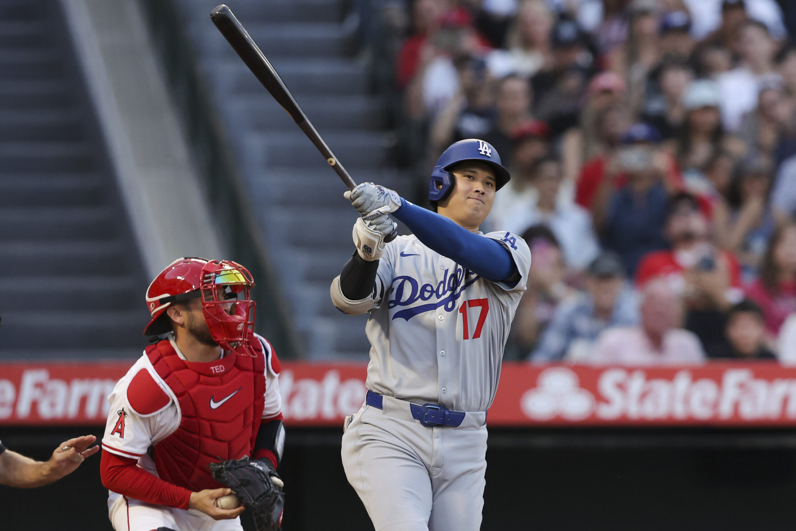 Dodgers star Shohei Ohtani strikes out swinging during the third...