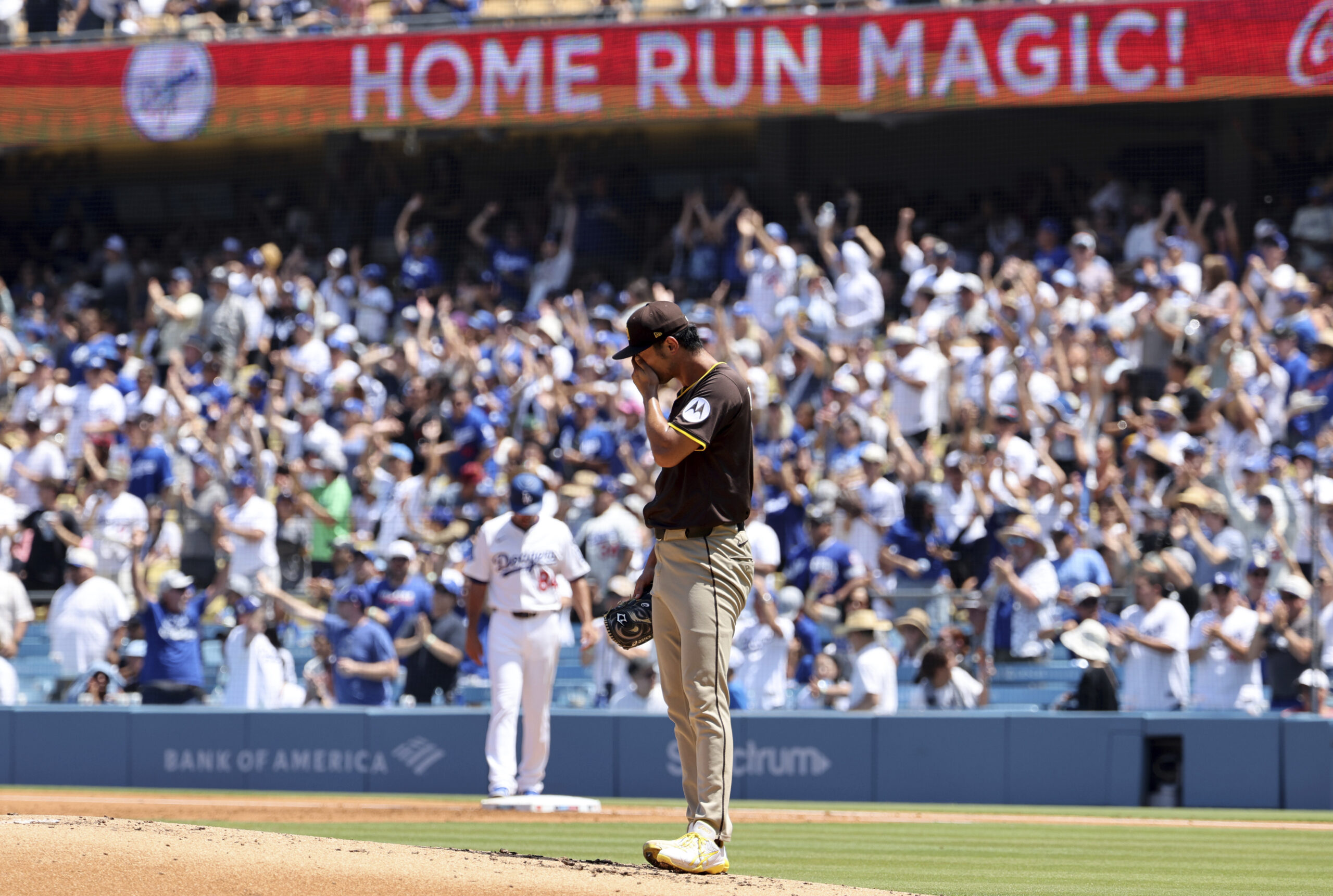San Diego Padres starting pitcher Yu Darvish reacts after giving...