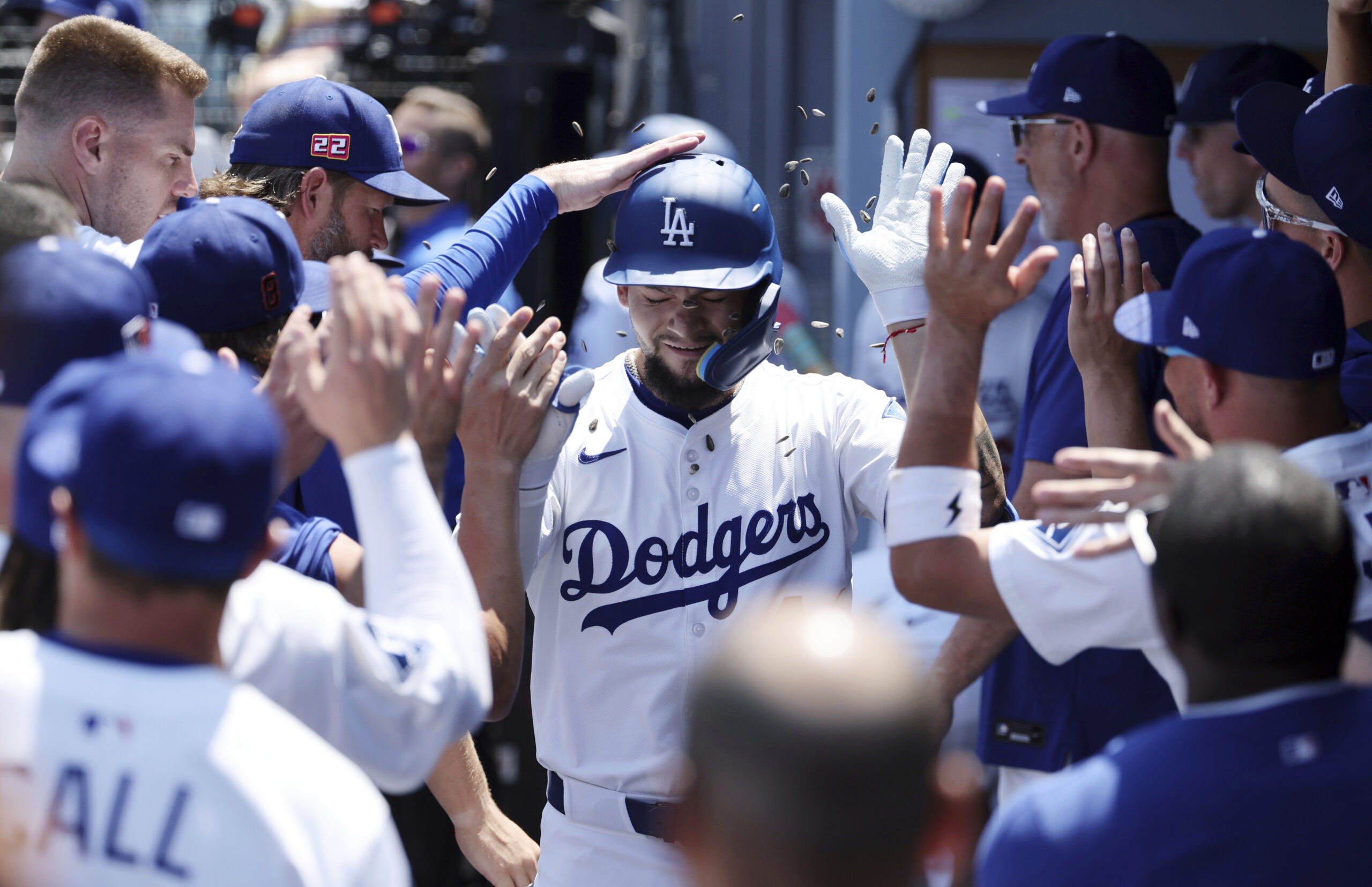 The Dodgers’ Andy Pages is congratulated in the dugout after...