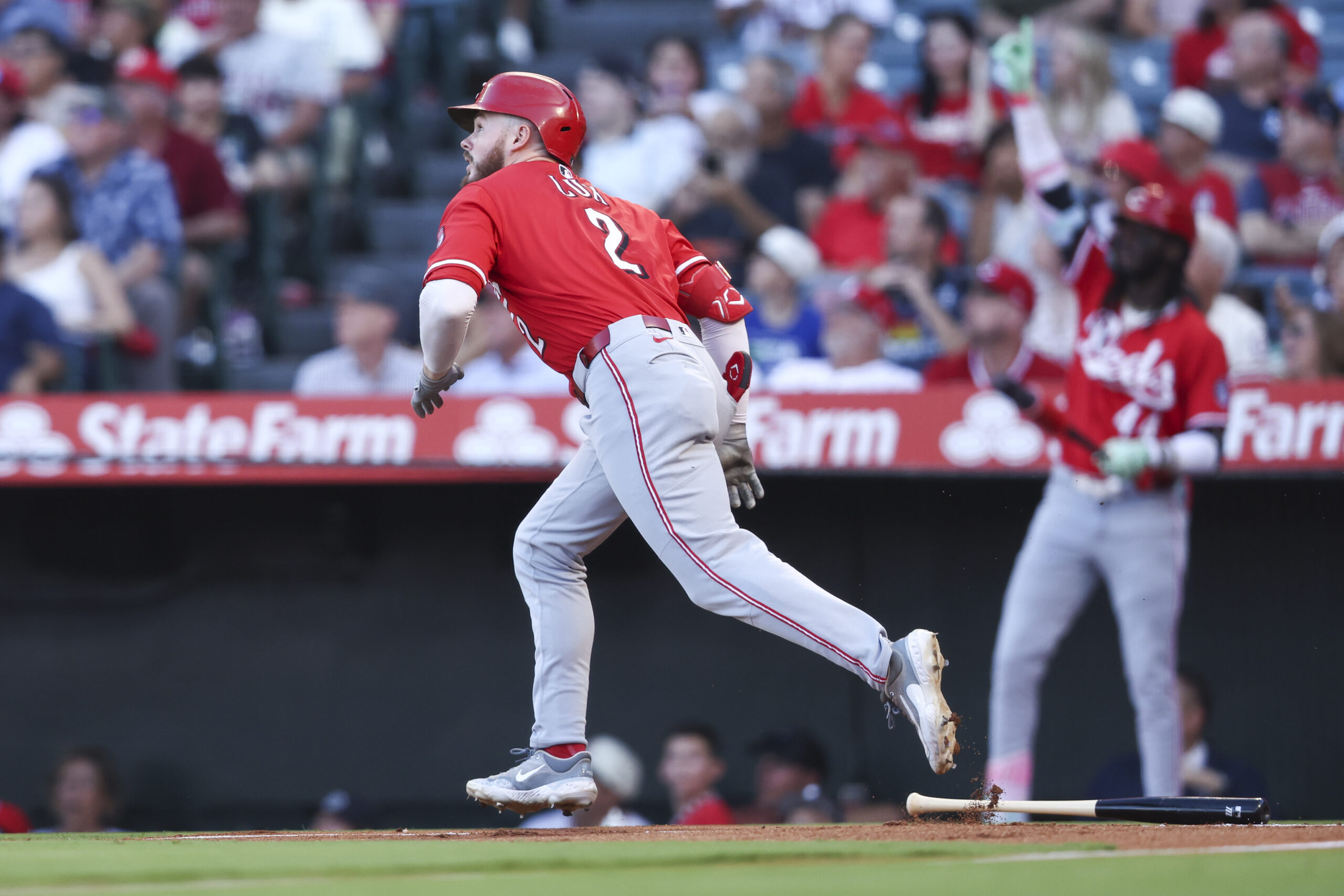 Cincinnati Reds designated hitter Gavin Lux runs after hitting a...