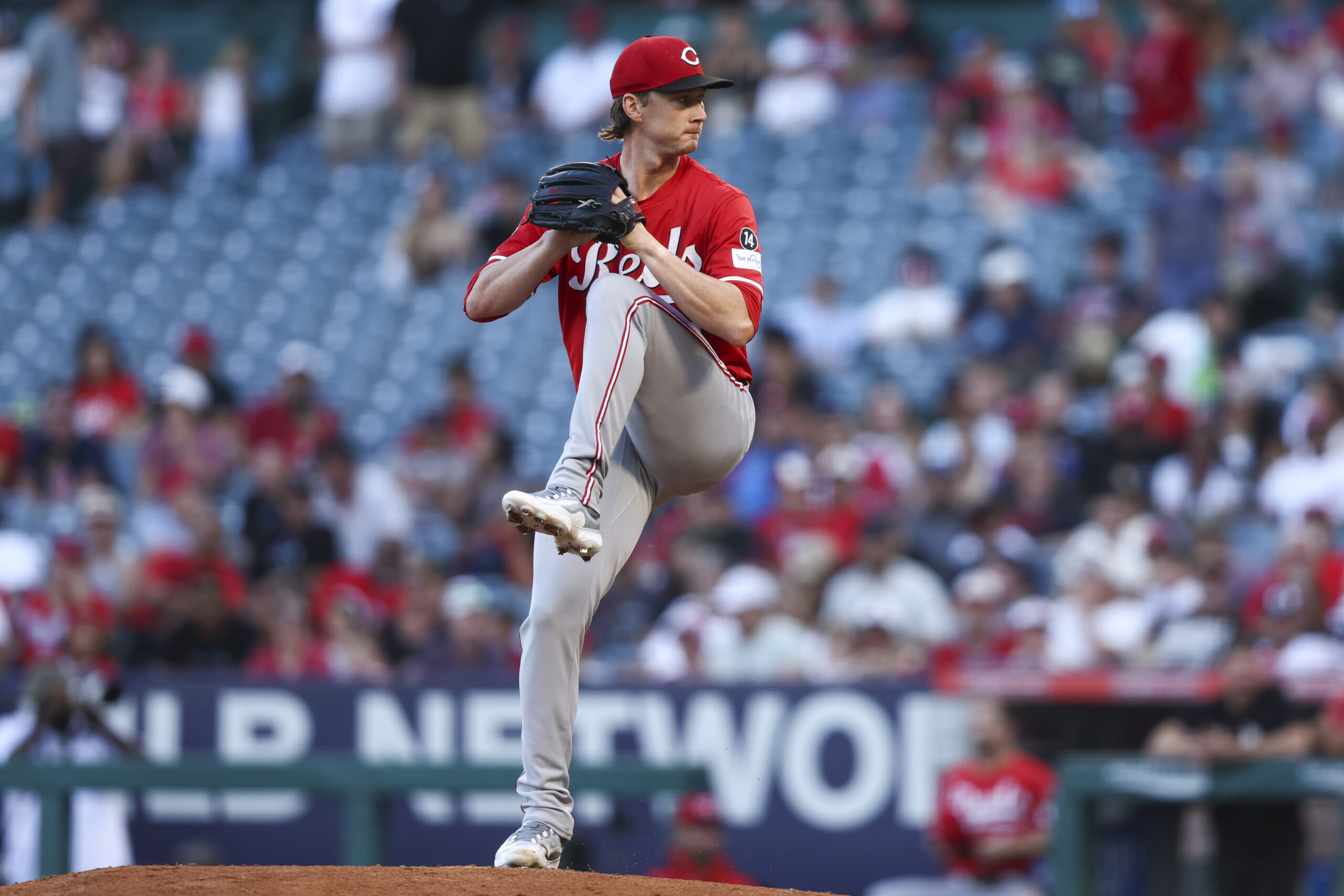 Cincinnati Reds pitcher Brady Singer throws to the plate during...