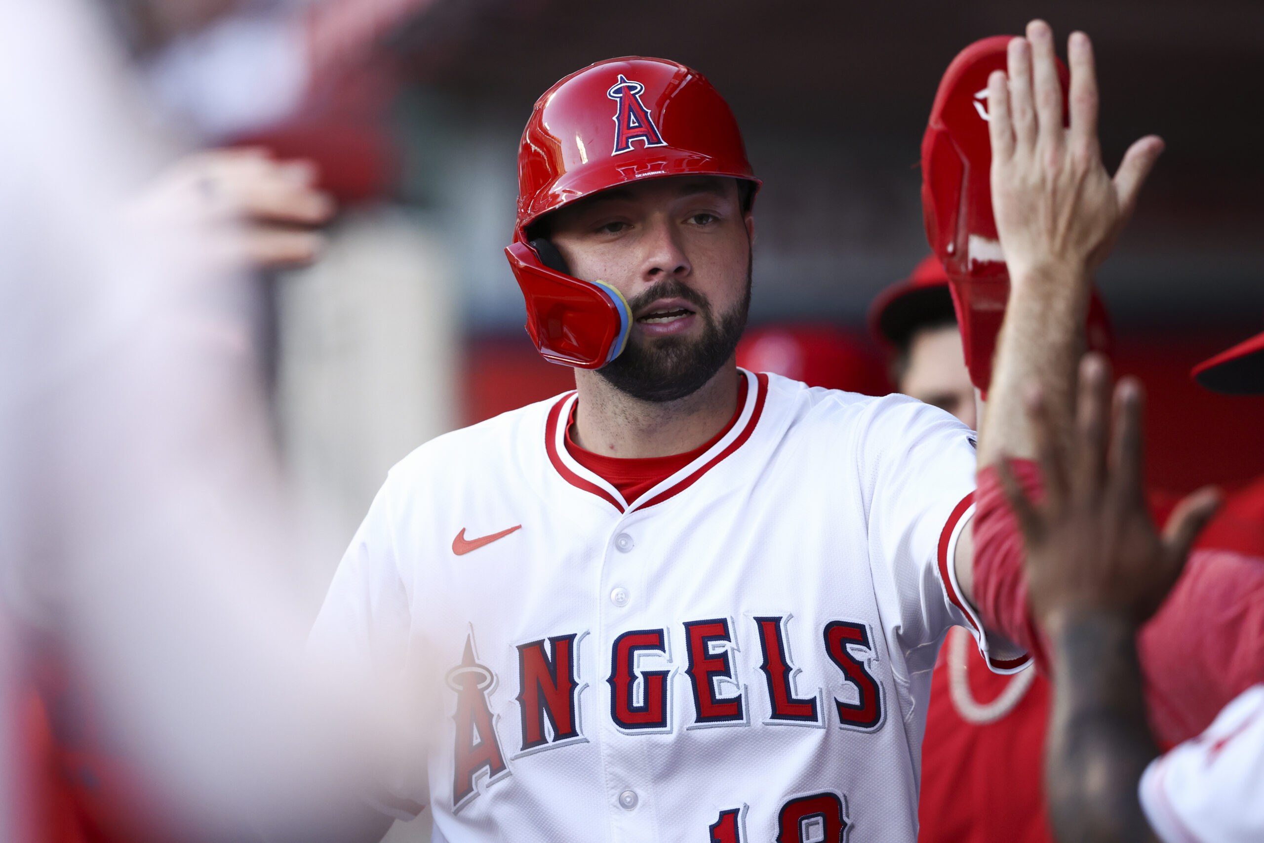 The Angels’ Nolan Schanuel celebrates in the dugout after scoring...