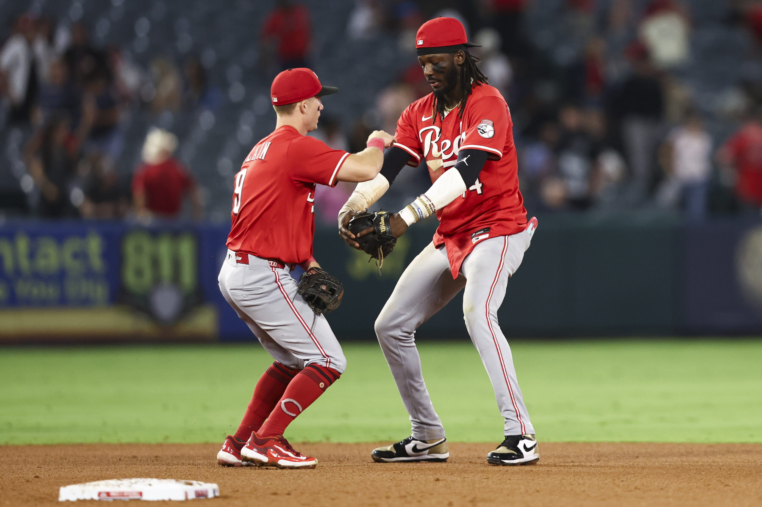 Cincinnati Reds second baseman Matt McLain, left, and shortstop Elly...