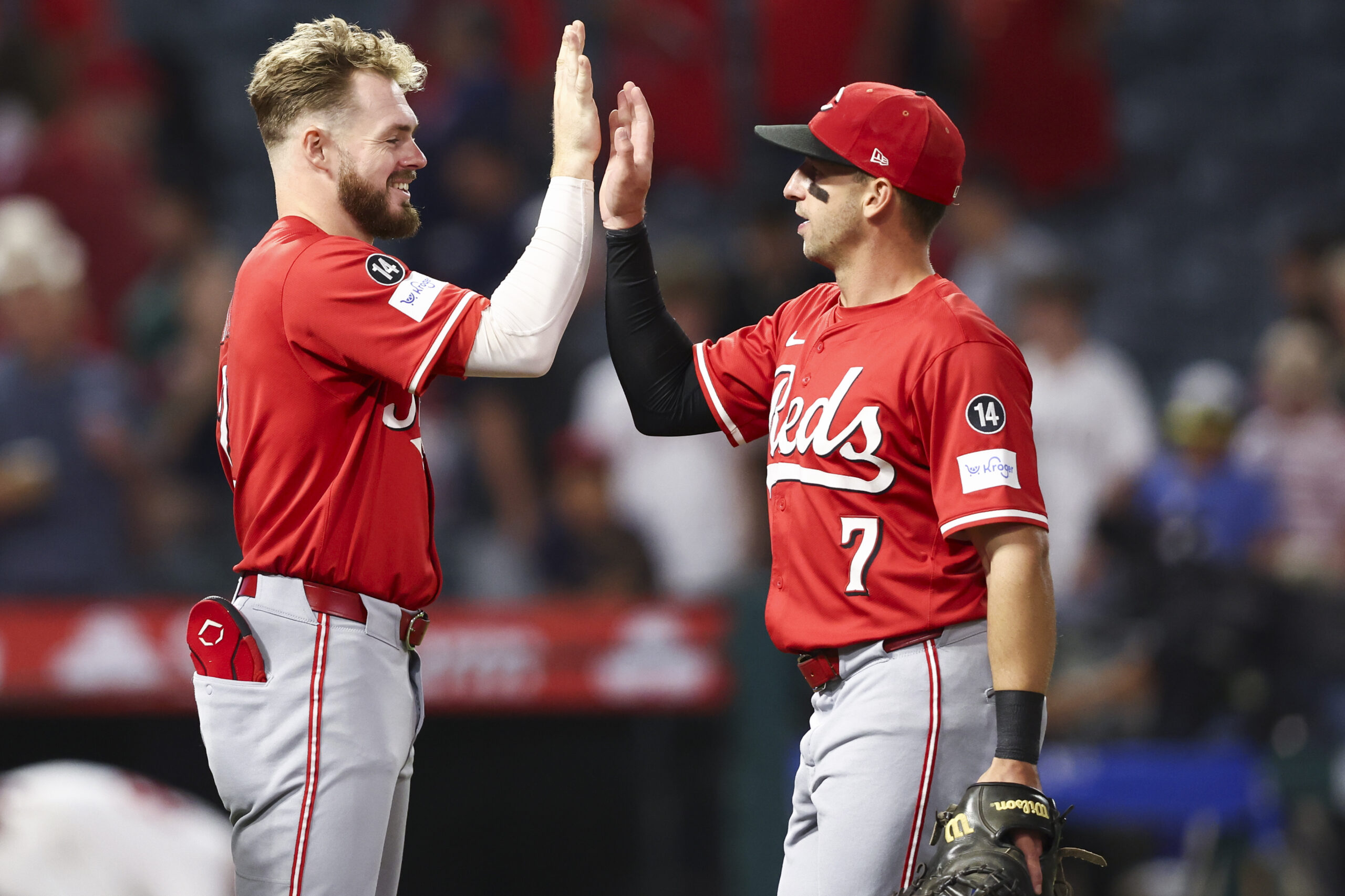 The Cincinnati Reds’ Gavin Lux, left, and first baseman Spencer...
