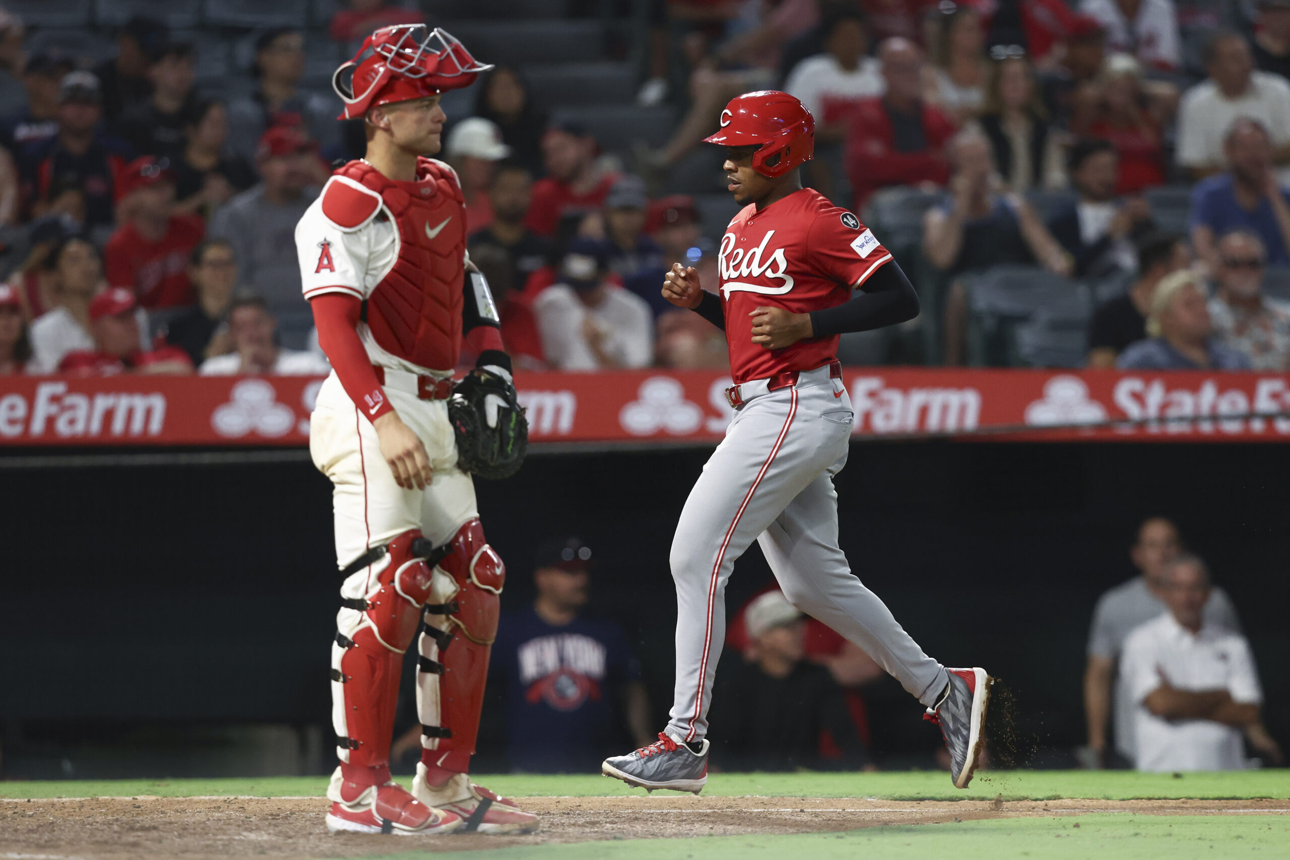 Cincinnati Reds’ Ke’Bryan Hayes runs towards home plate to score...