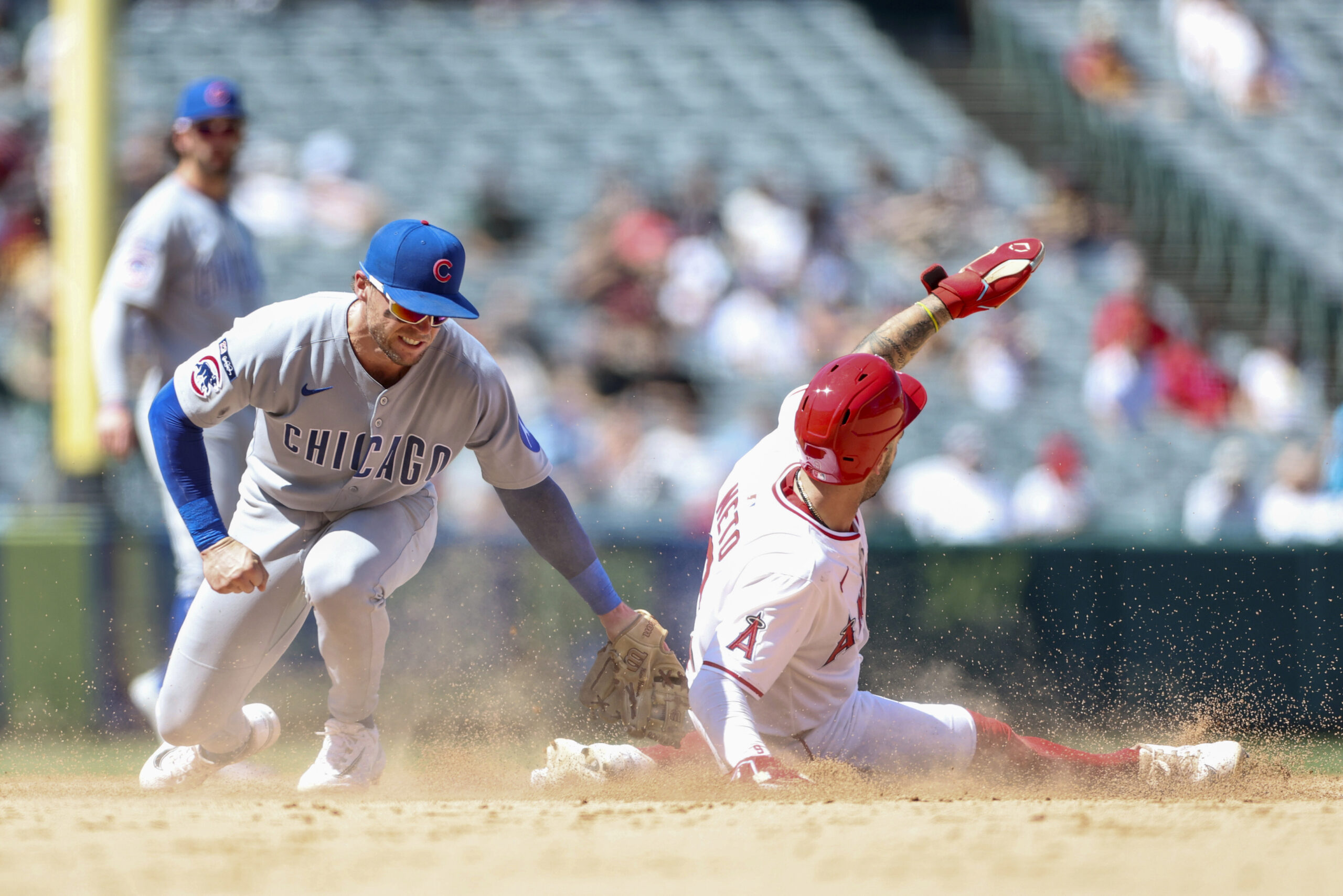 The Angels’ Zach Neto, right, steals second base as Chicago...