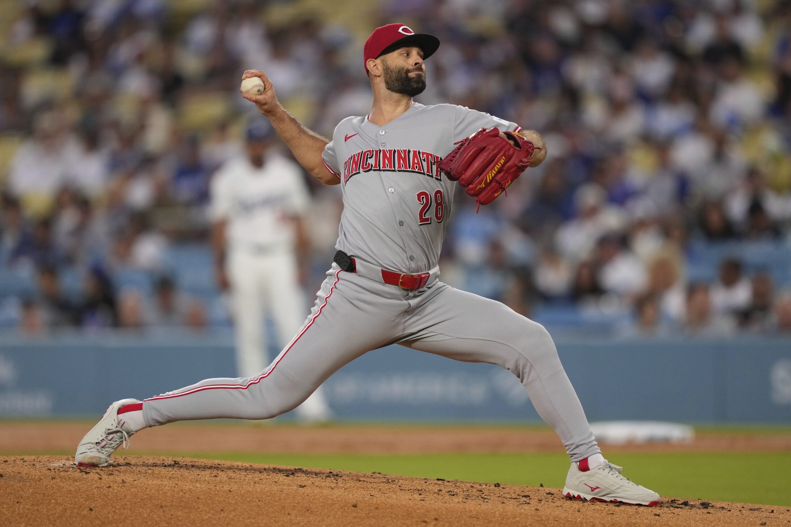 Cincinnati Reds starting pitcher Nick Martinez throws to the plate...