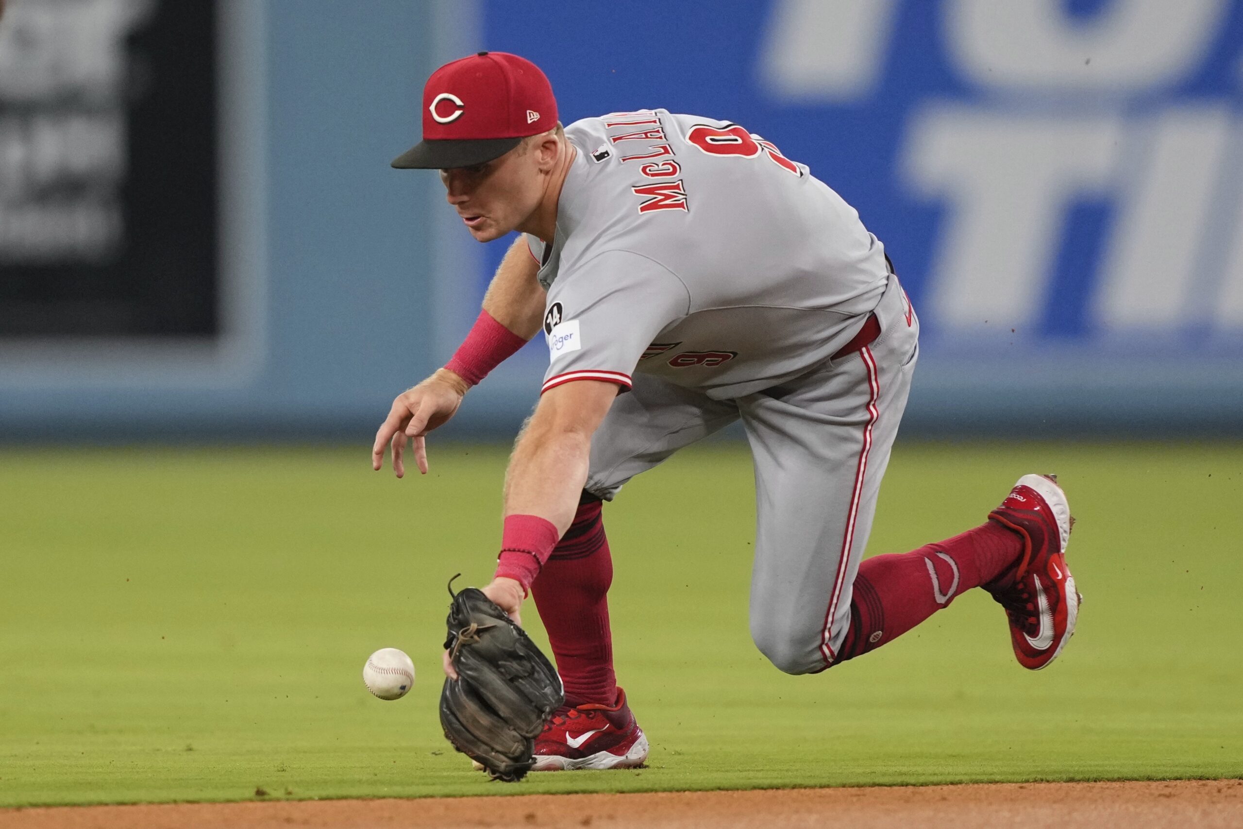 Cincinnati Reds second baseman Matt McLain can’t handle a ball...