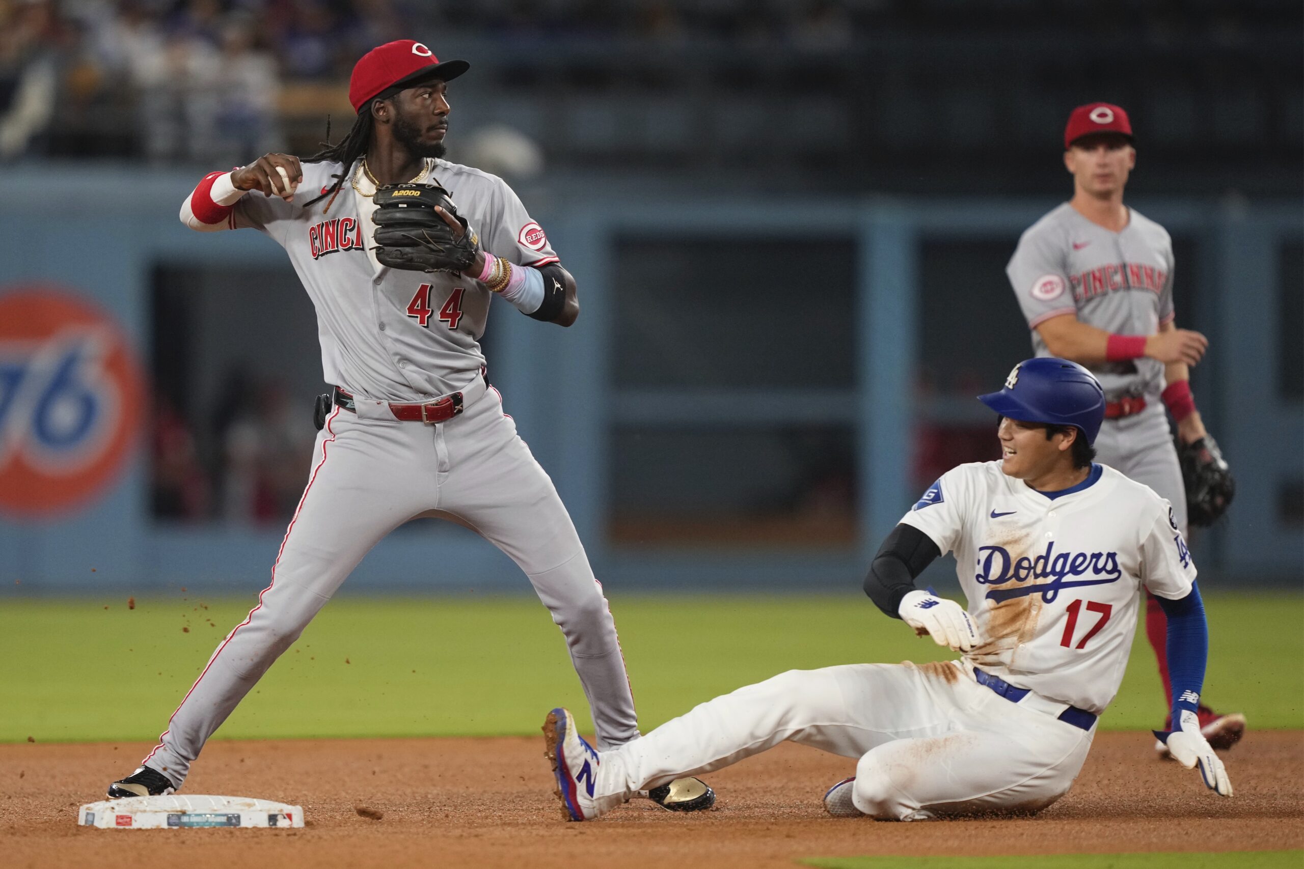 Dodgers star Shohei Ohtani, right, is forced out at second...