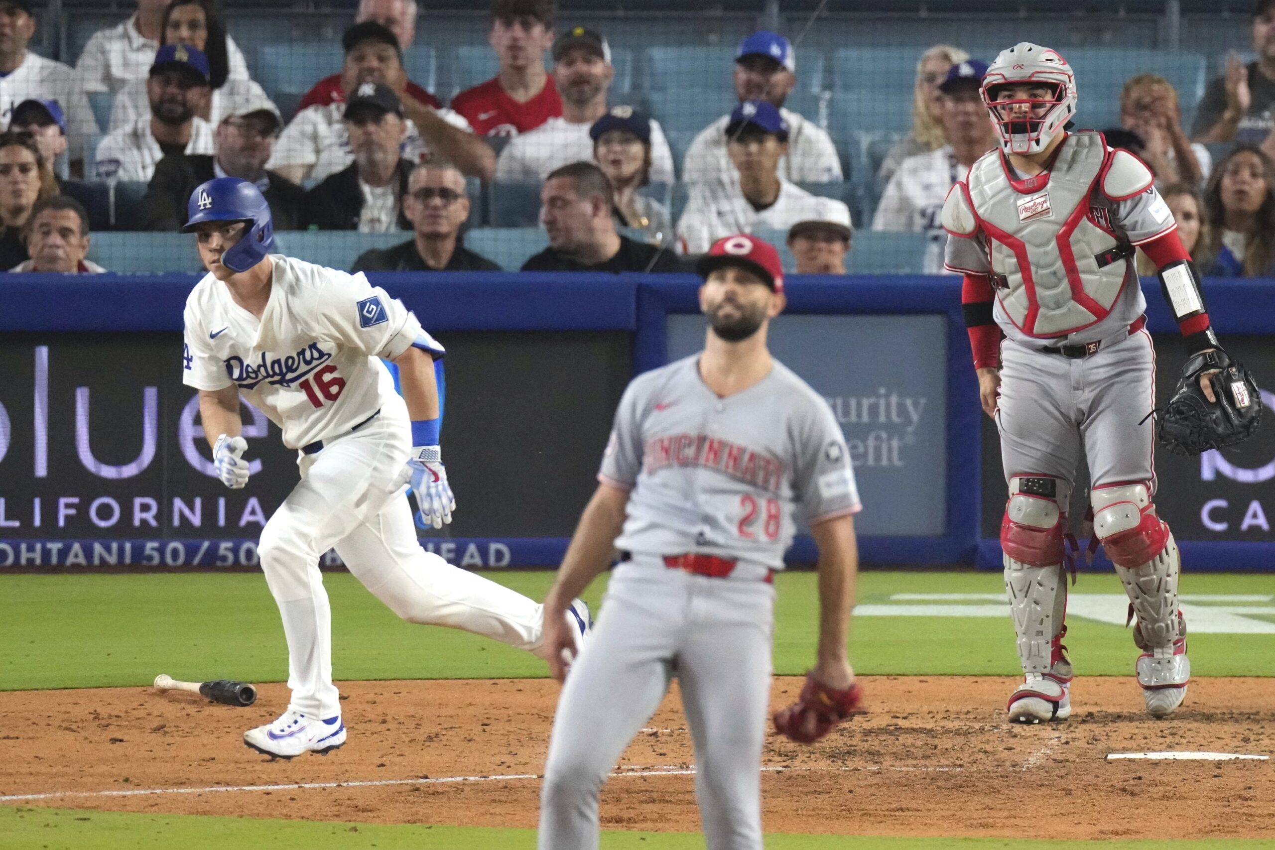 The Dodgers’ Will Smith, left, begins to run the bases...