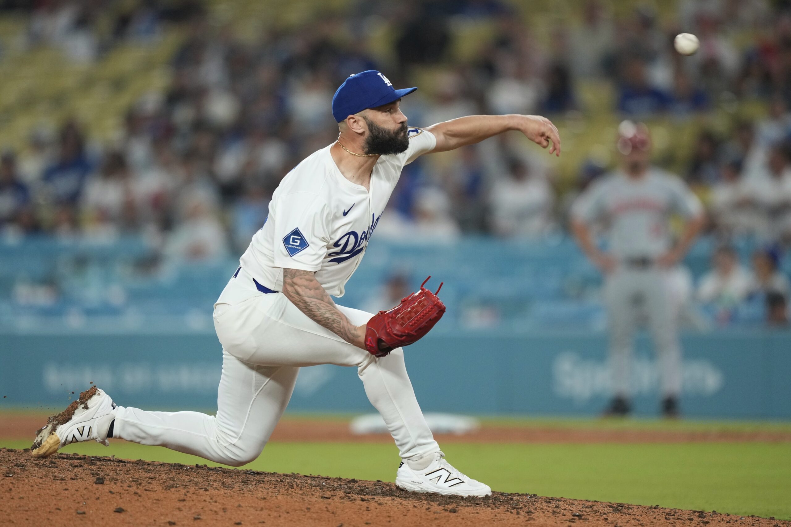 Dodgers relief pitcher Tanner Scott throws to the plate during...