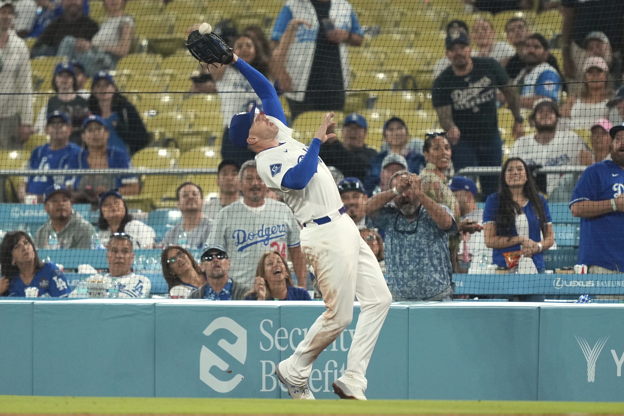 Dodgers first baseman Freddie Freeman makes a catch on a...