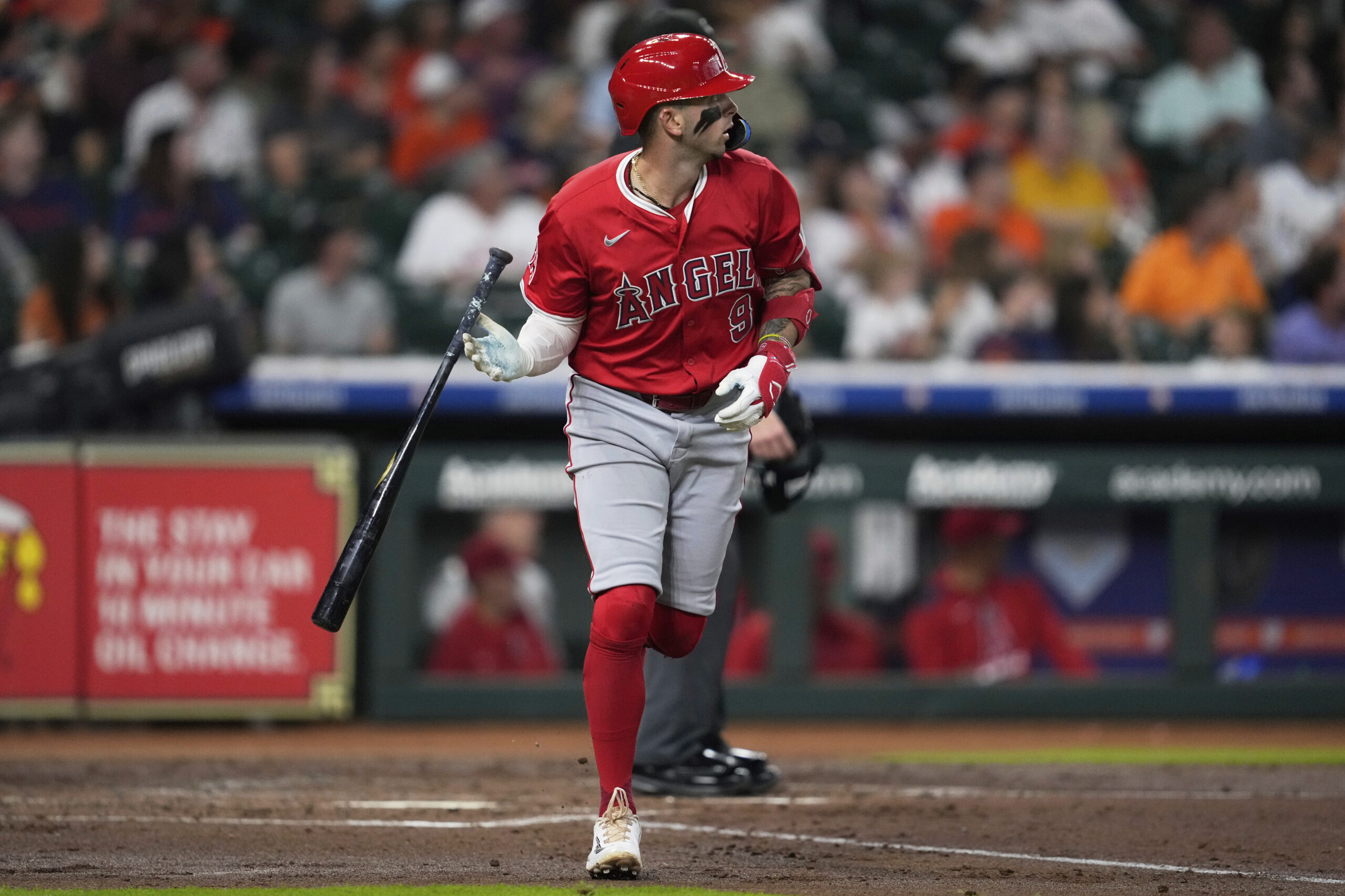Angels’ Zach Neto drops his bat after hitting a home...