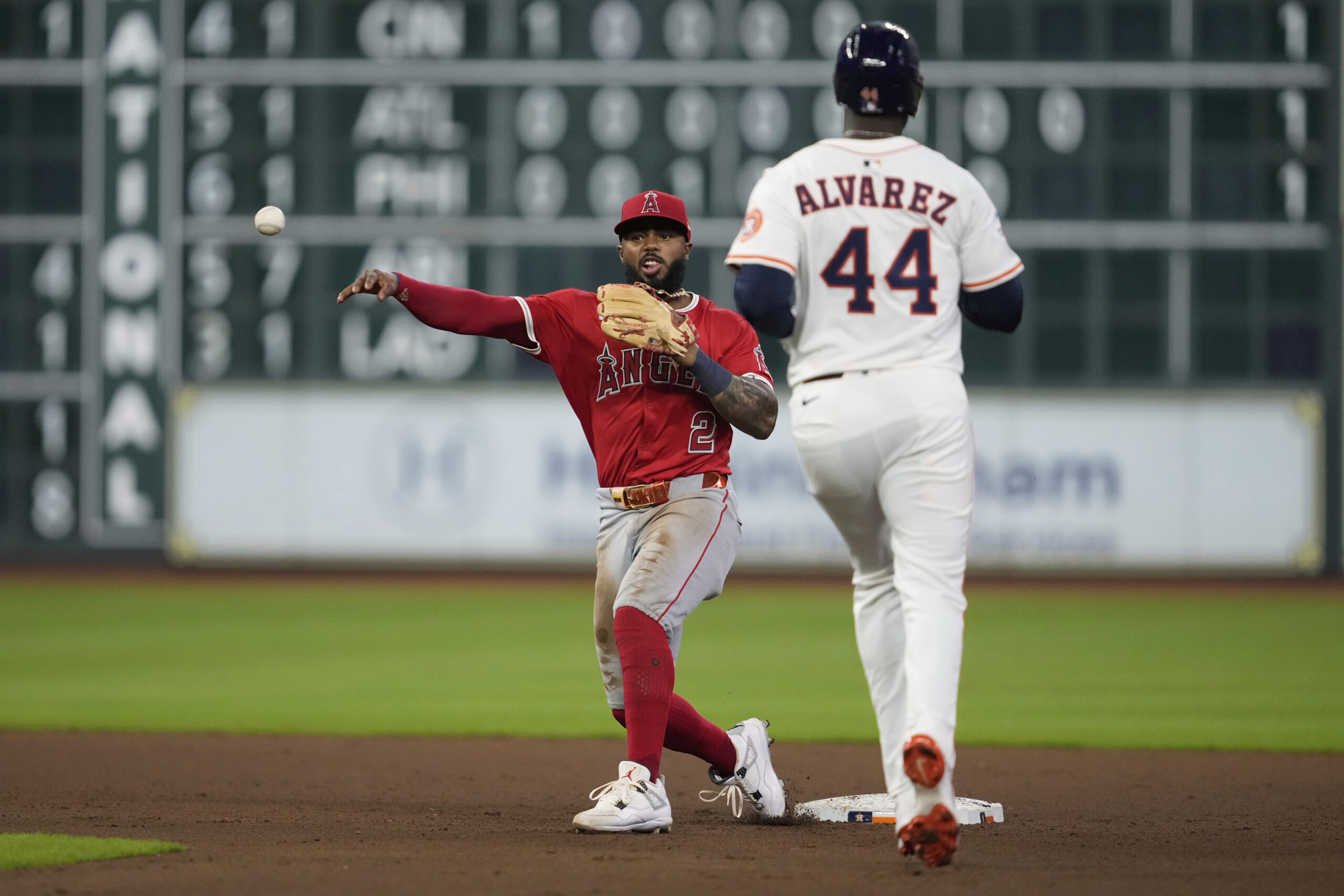 Angels second baseman Luis Rengifo (2) throws to first for...