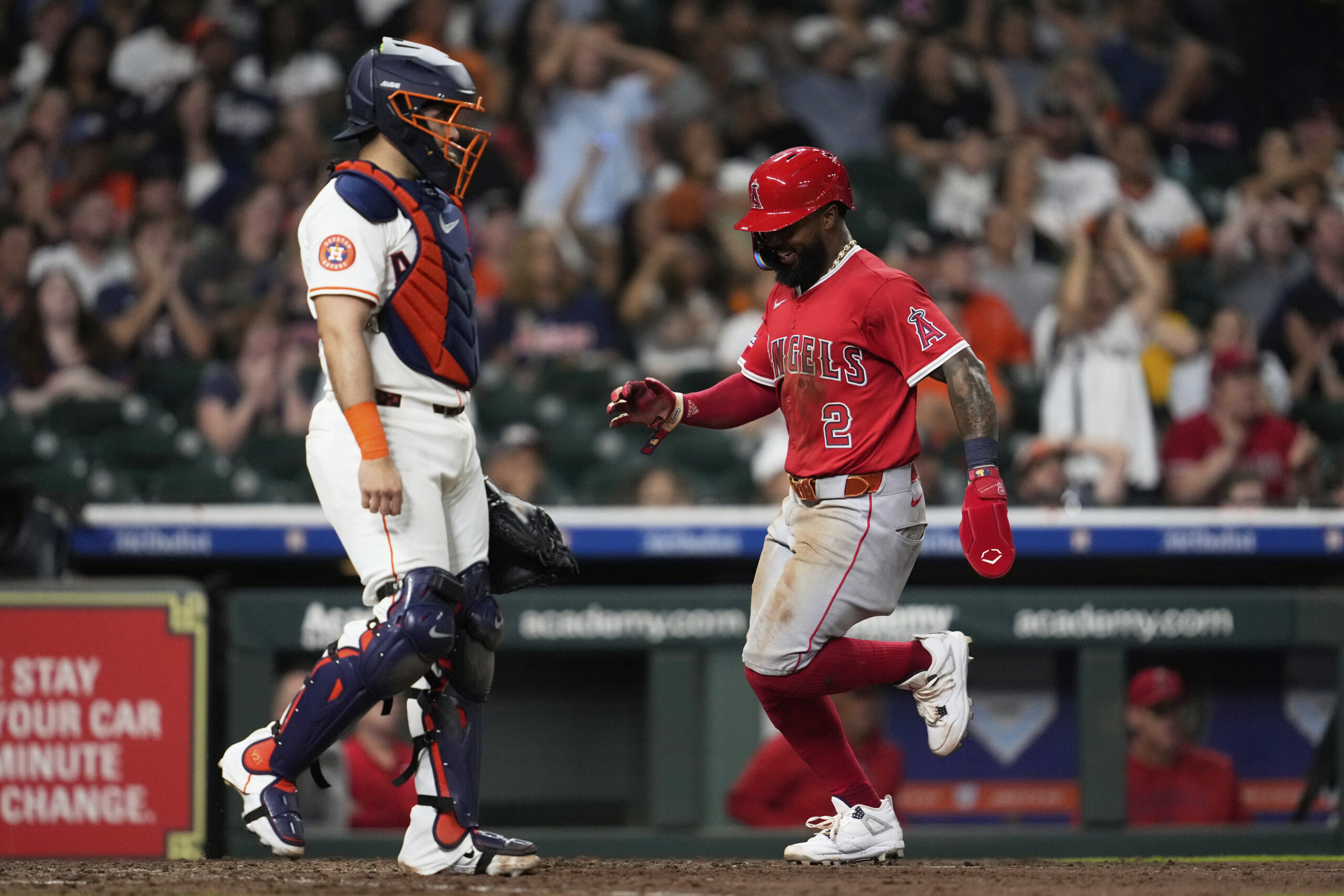 Angels’ Luis Rengifo (2) scores off of a single by...