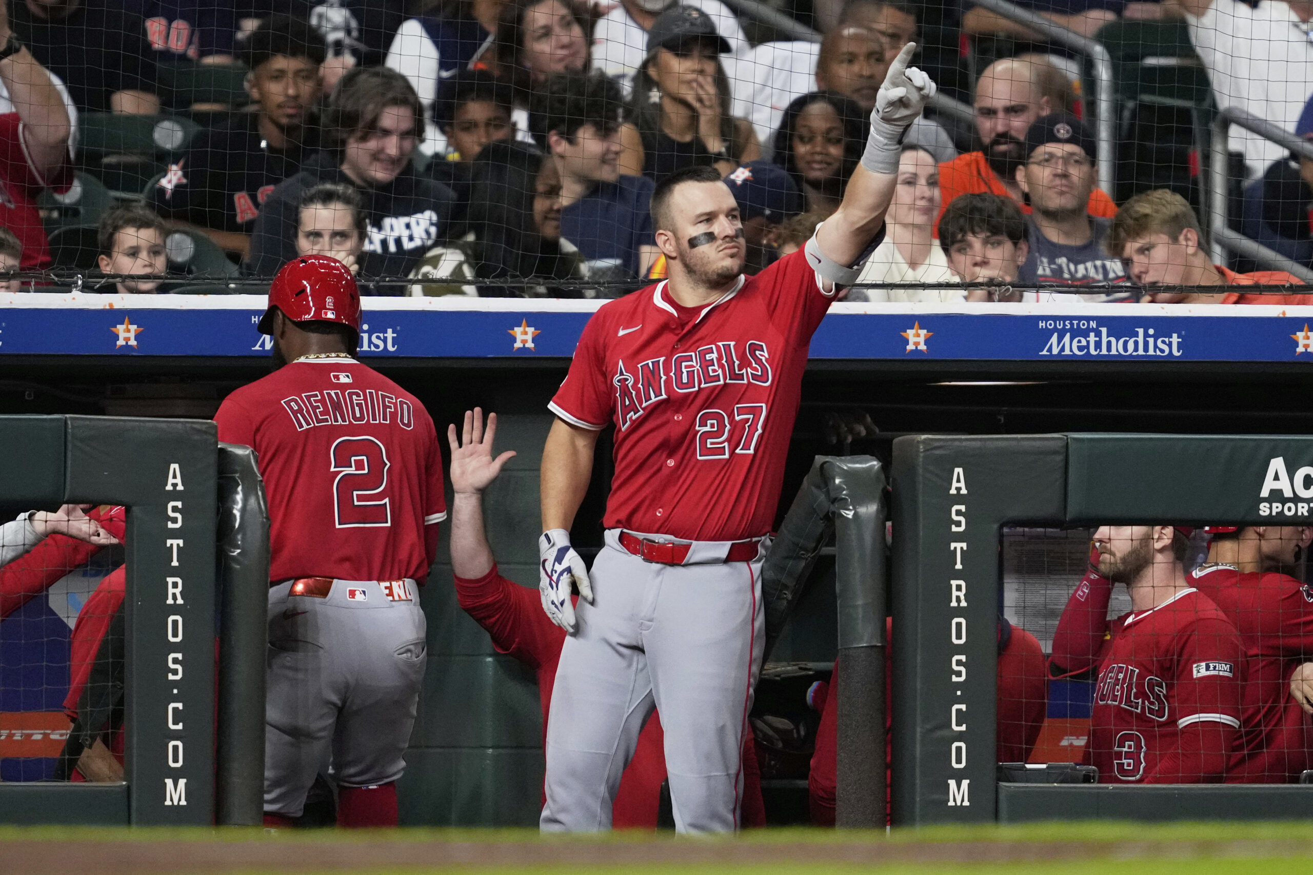 Angels designated hitter Mike Trout (27) celebrates after Logan O’Hoppe...