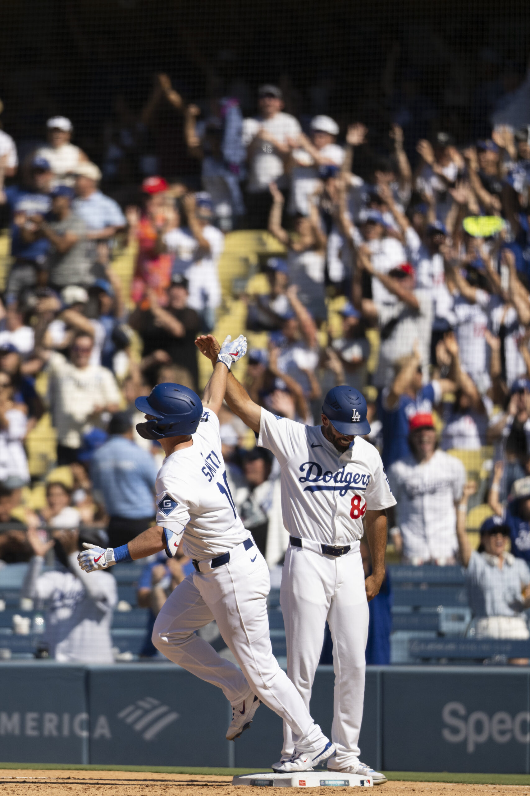 Dodgers’ Will Smith, left, celebrates after his walkoff solo home...