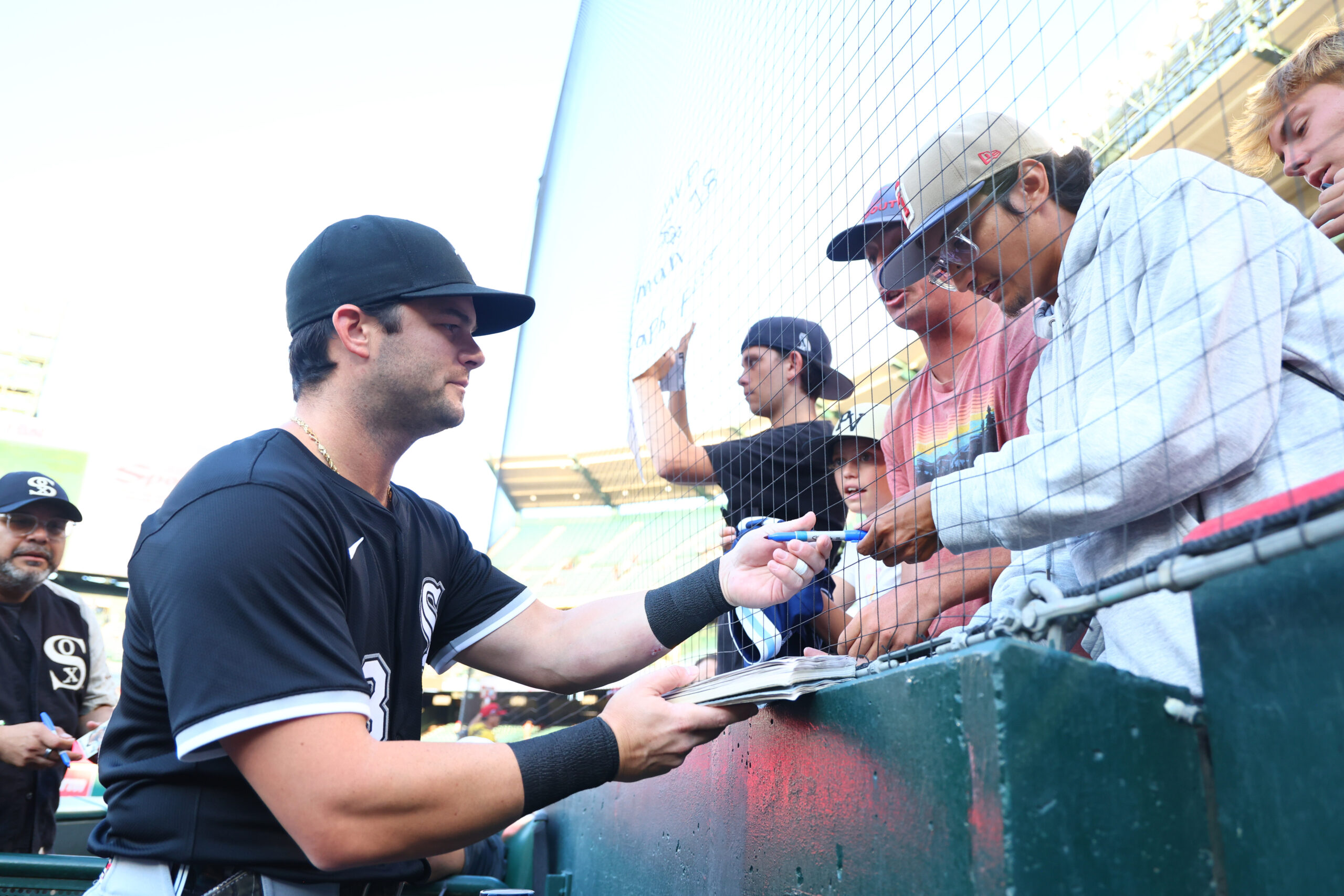 Chicago White Sox outfielder Andrew Benintendi #23 signs autographs prior...