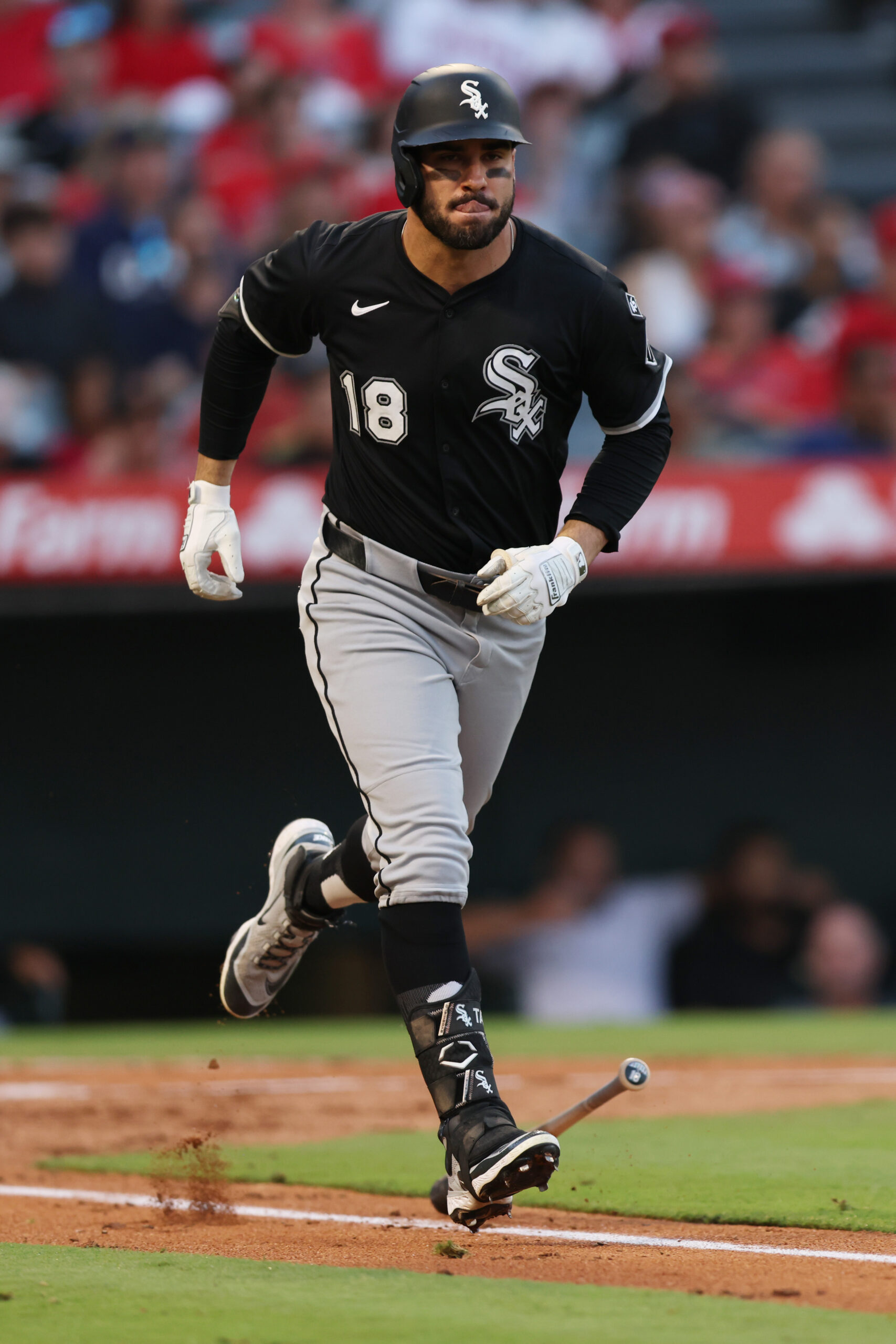 Outfielder Mike Tauchman #18 of the Chicago White Sox runs...