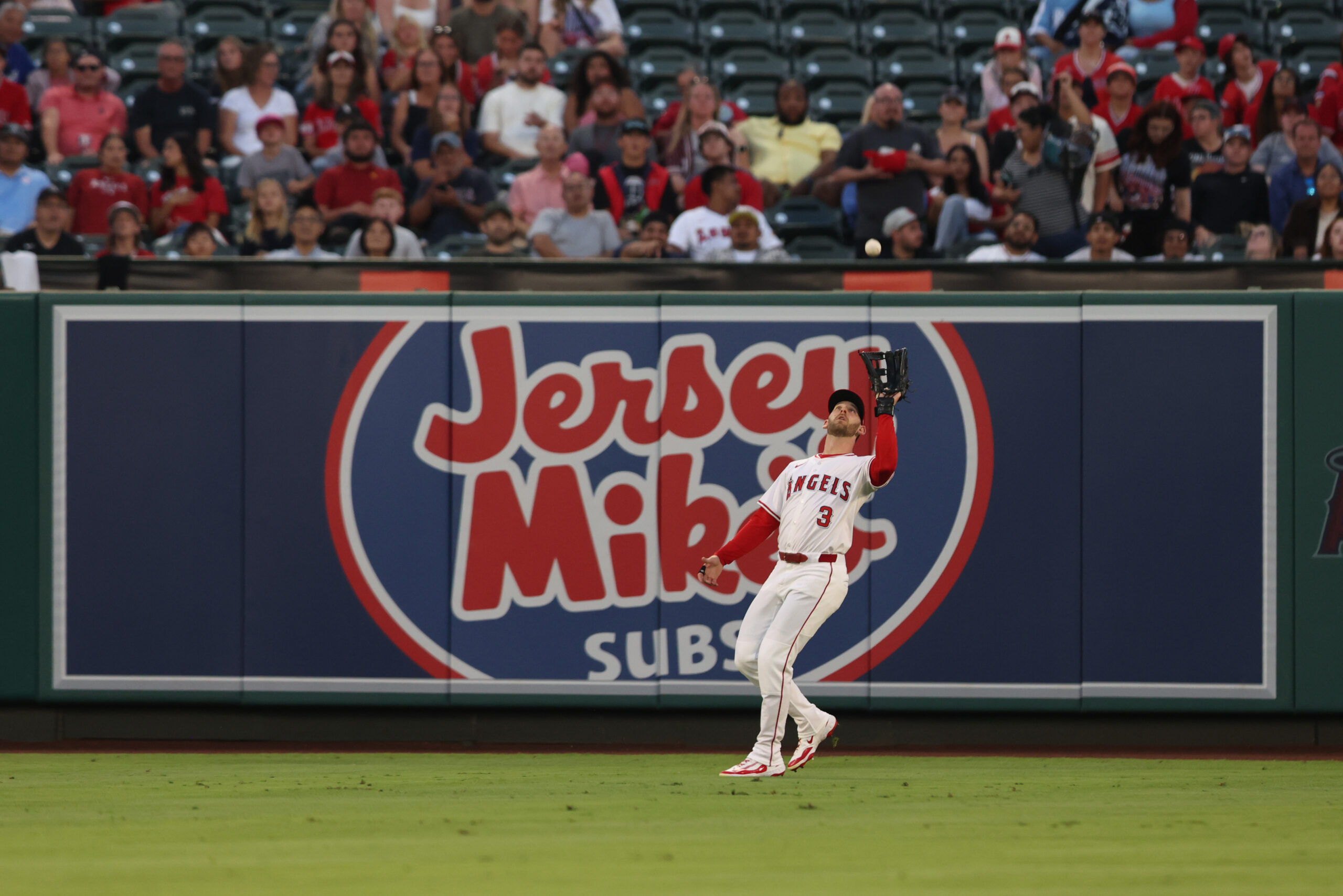 Outfielder Taylor Ward #3 of the Angels makes a catch...